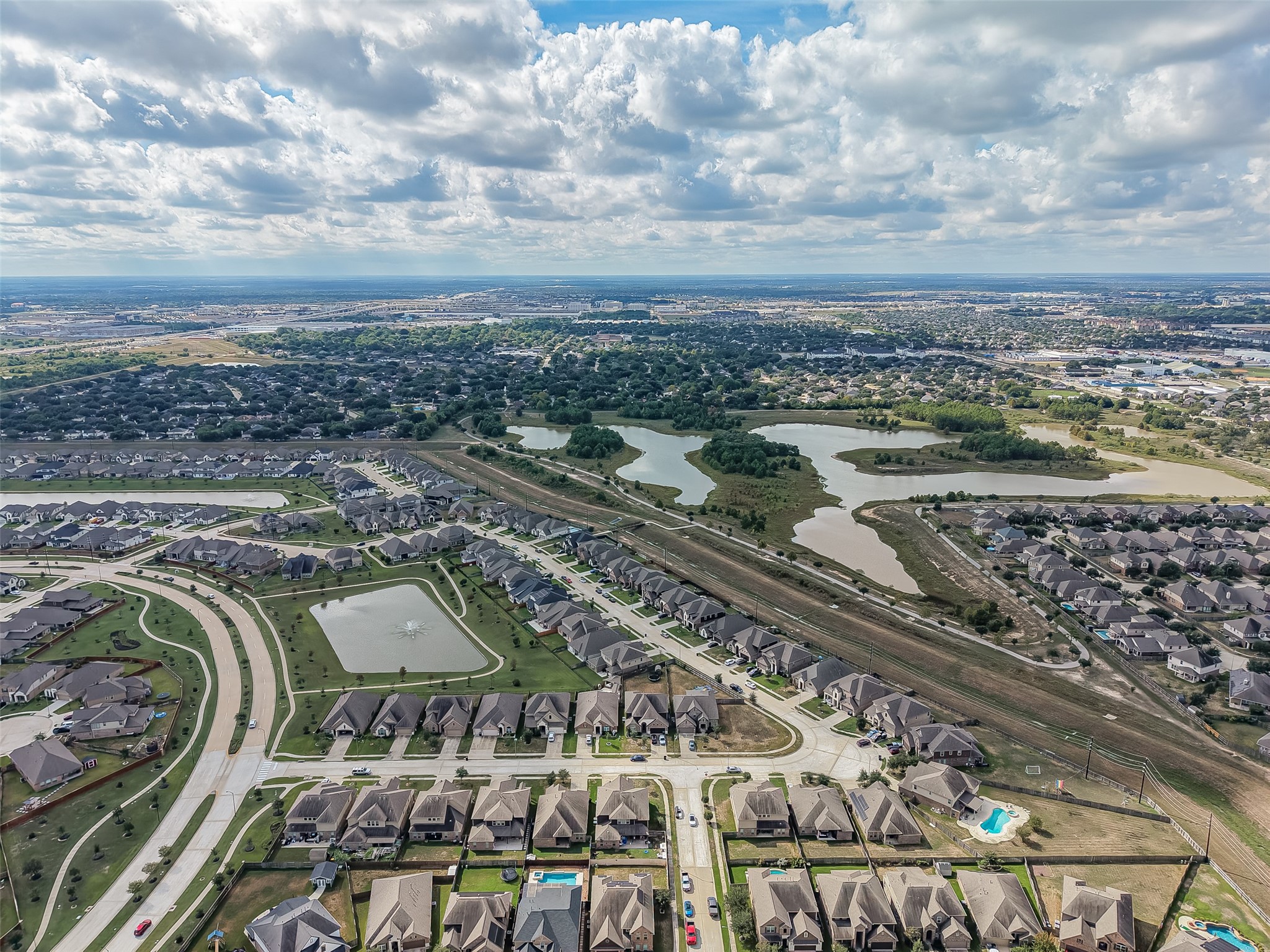 Charming residential neighborhood with well-maintained homes, scenic ponds, and lush greenery, offering a peaceful suburban lifestyle with convenient access to nearby amenities.