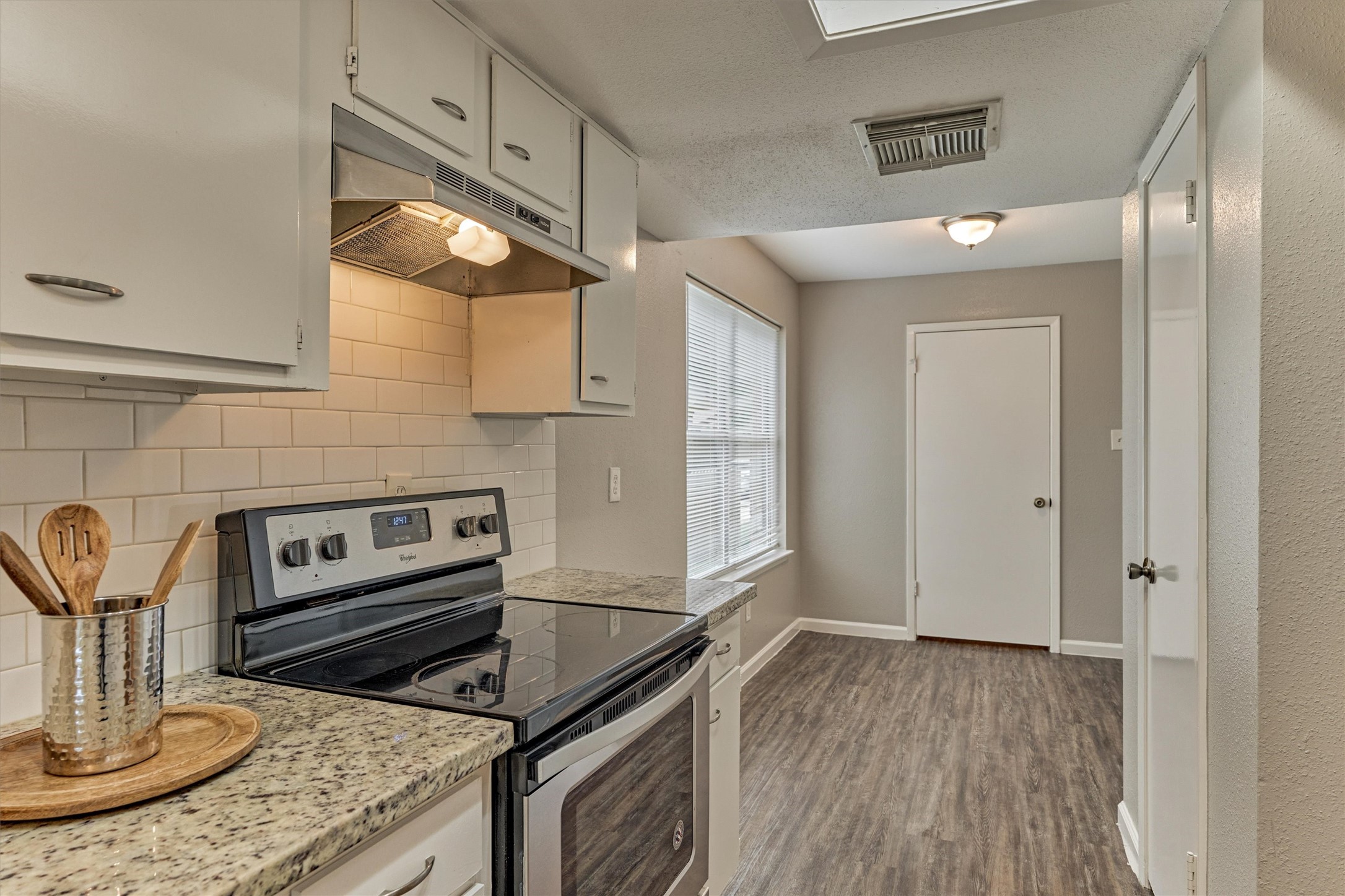 Your refrigerator will sit to the right of the cabinet next to the range.