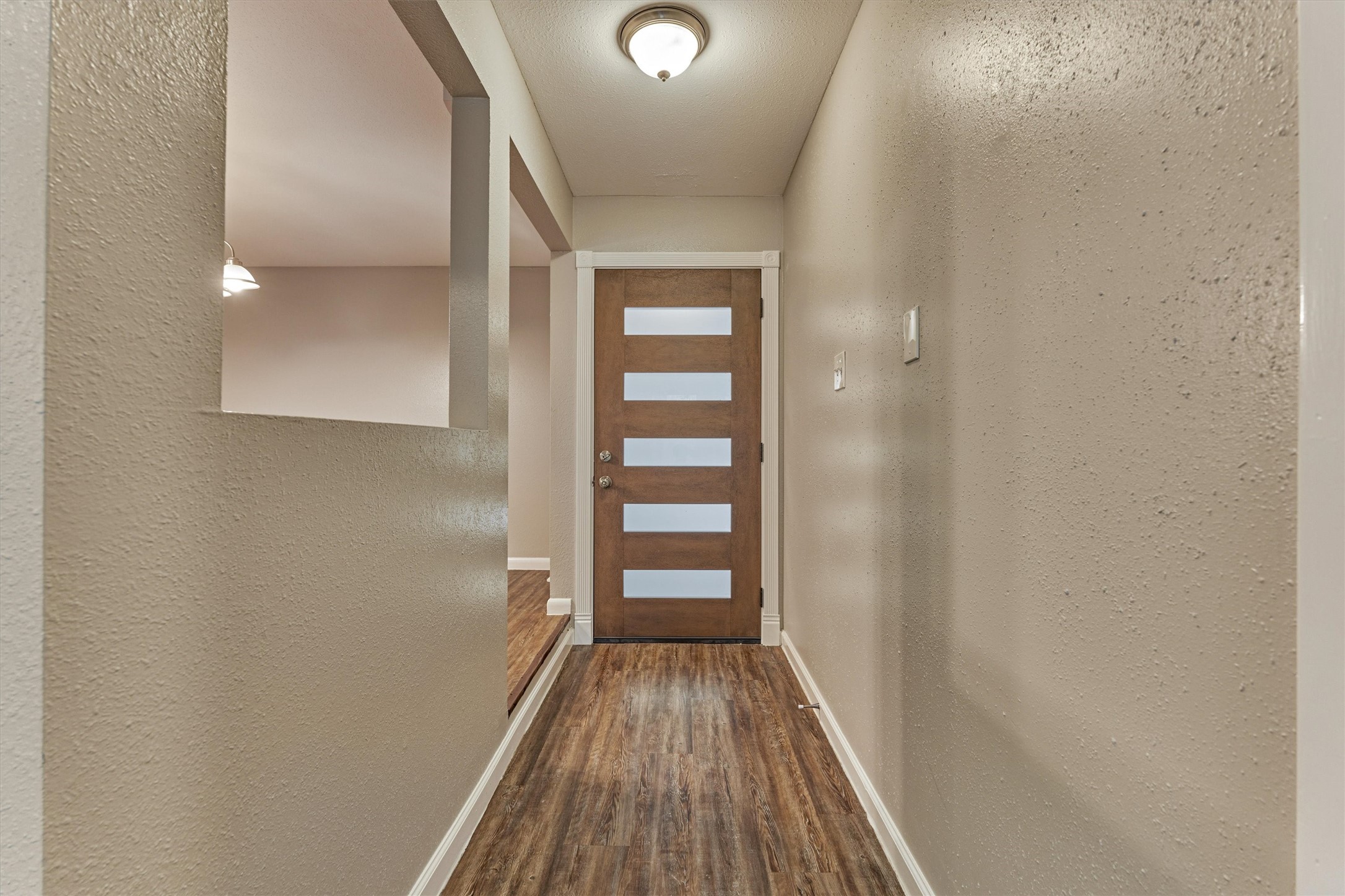 Looking from the living area to the front entrance.