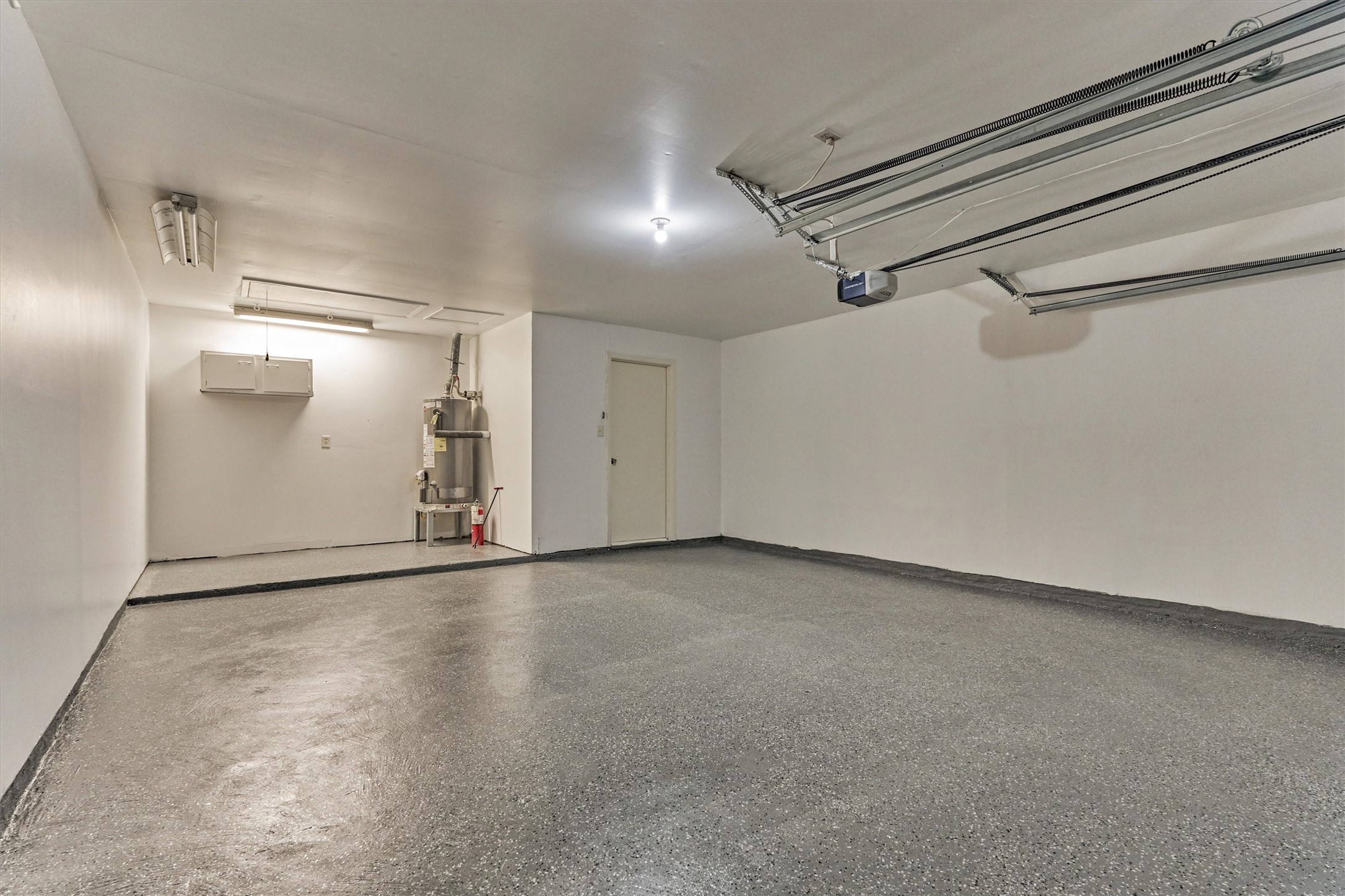 The additional length on the left side of the garage is ideal for a work bench or lawn equipment storage.