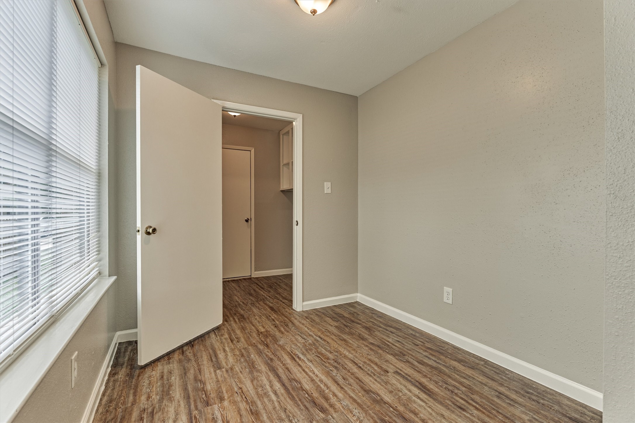 The breakfast area showing entry to the laundry room and further on, the garage.
