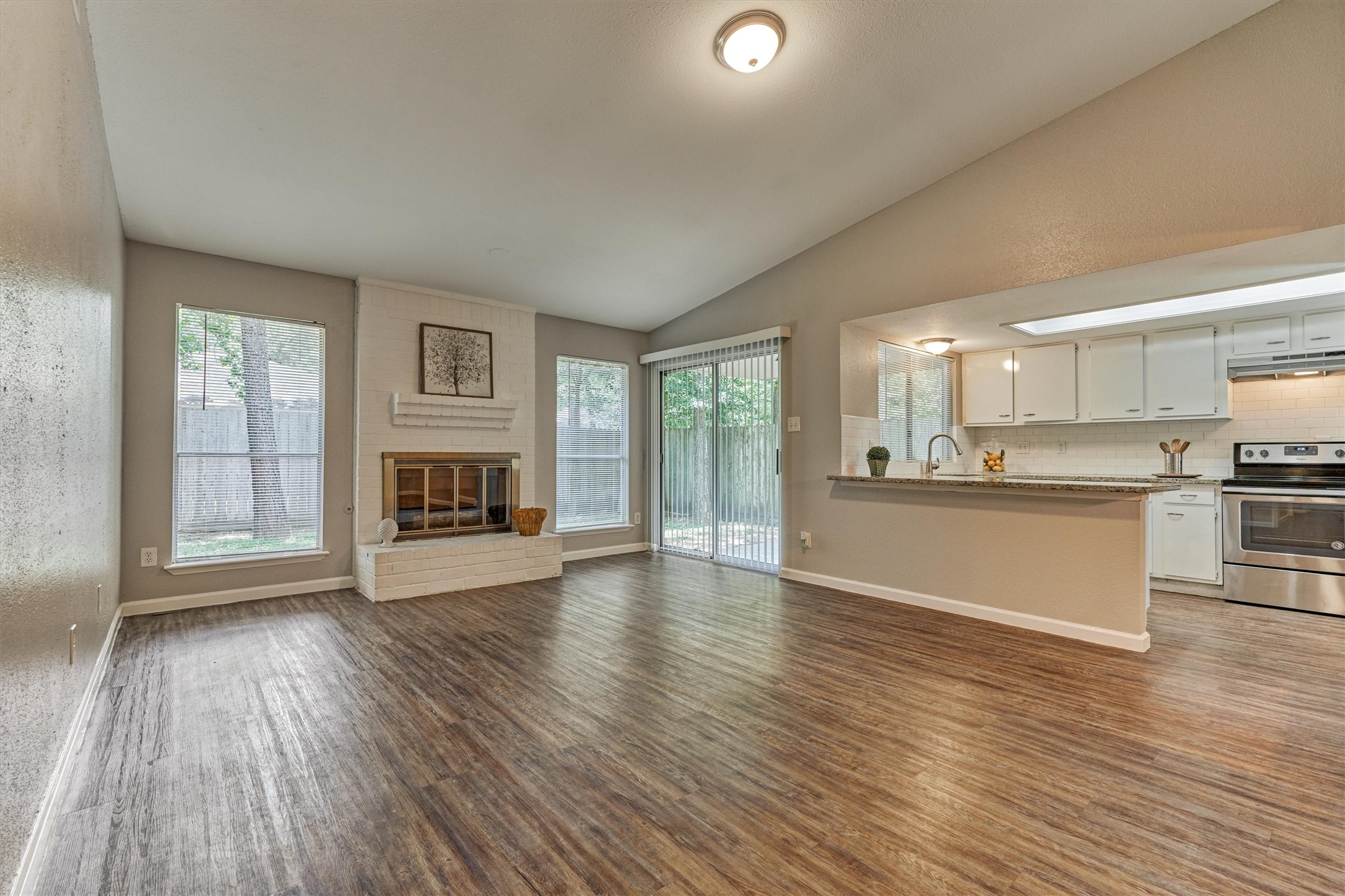 The sliding glass door provides convenient access to the covered porch and back yard.