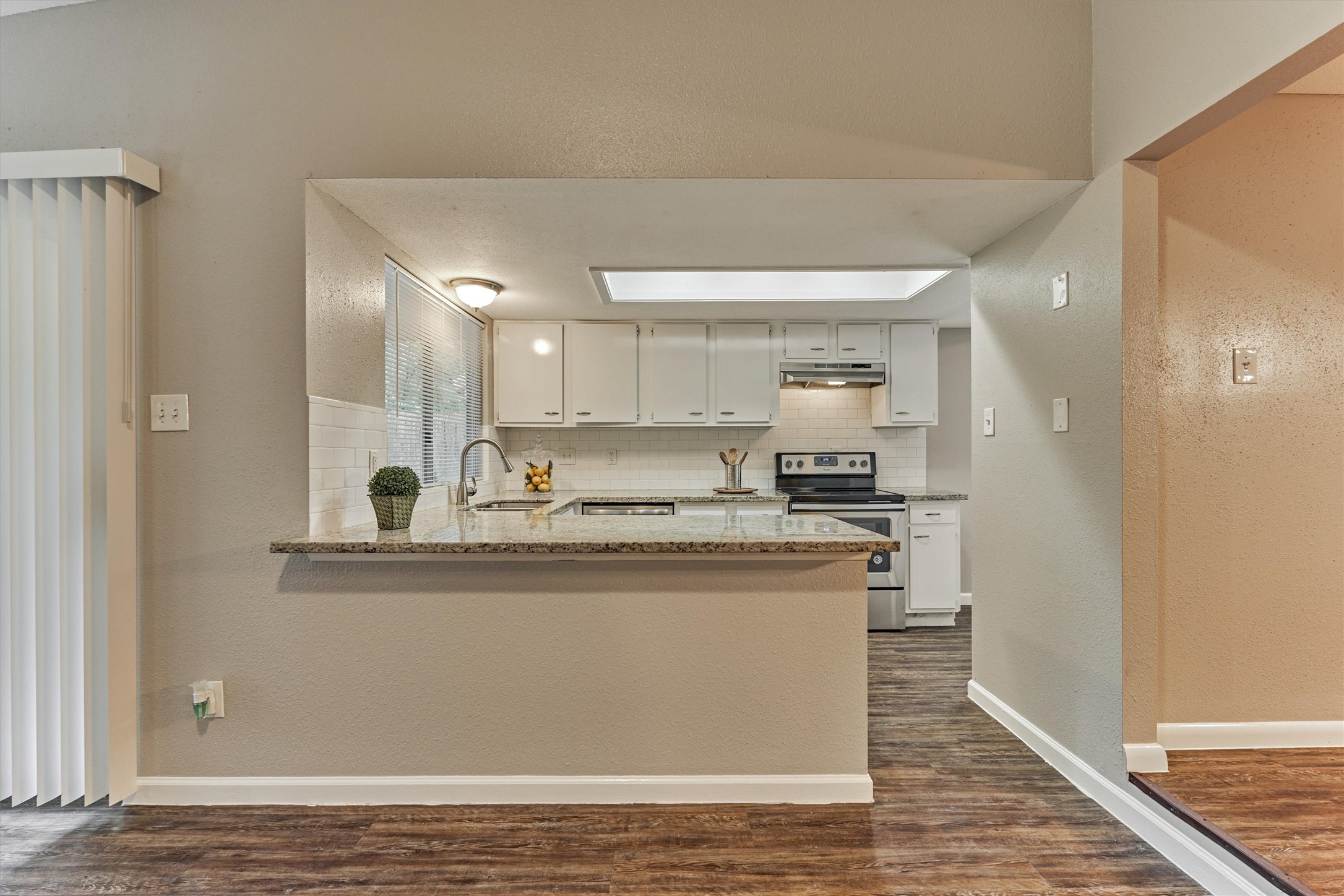 The kitchen is open to the living area and the dining room.