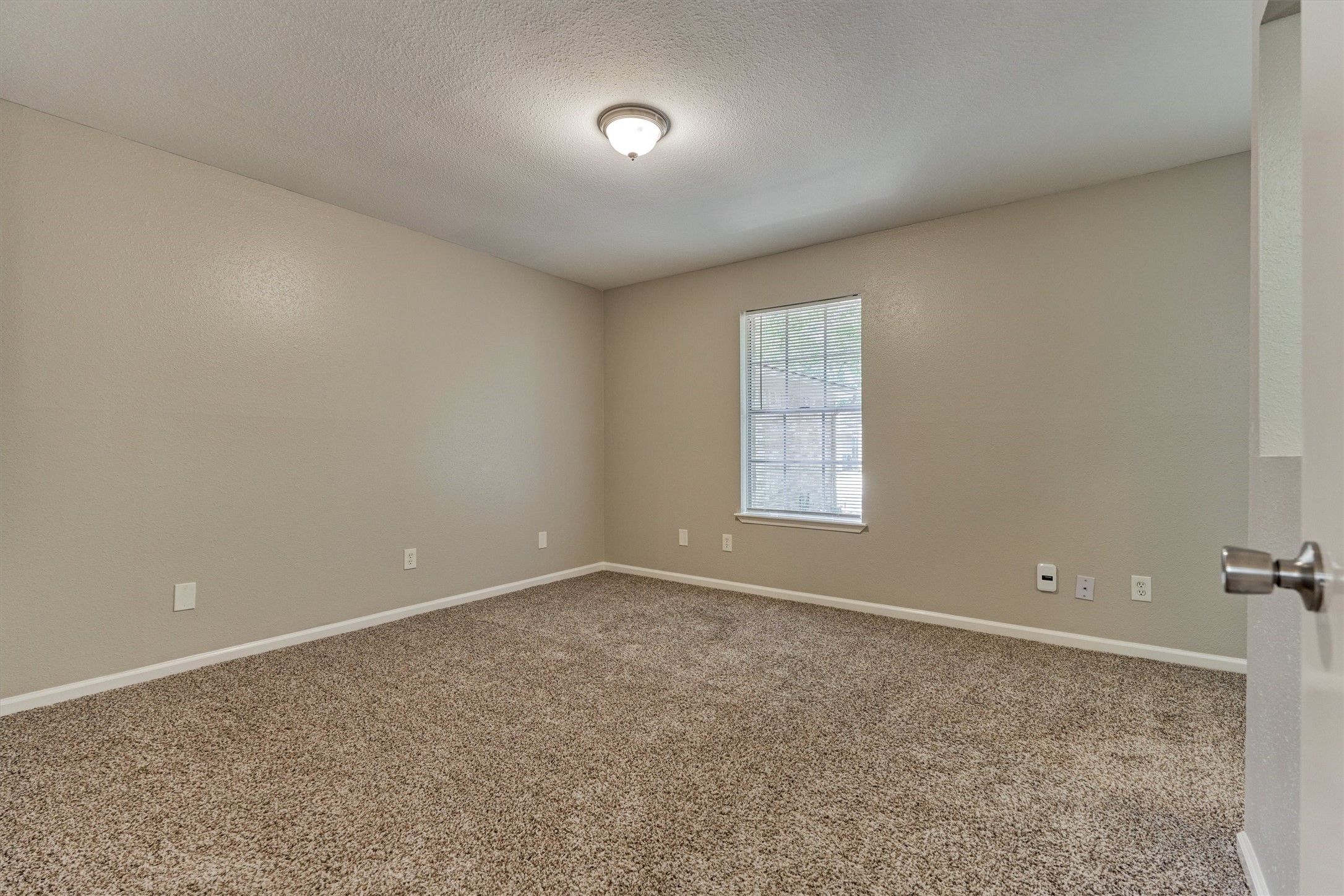 The primary bedroom with ensuite bathroom.