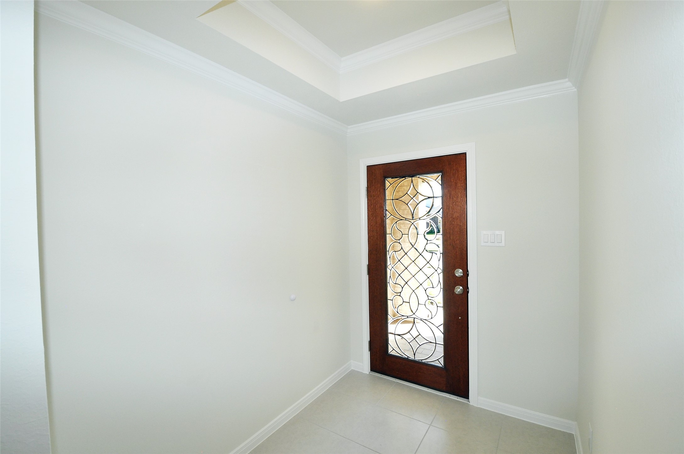 Triple pane etched glass entry door.