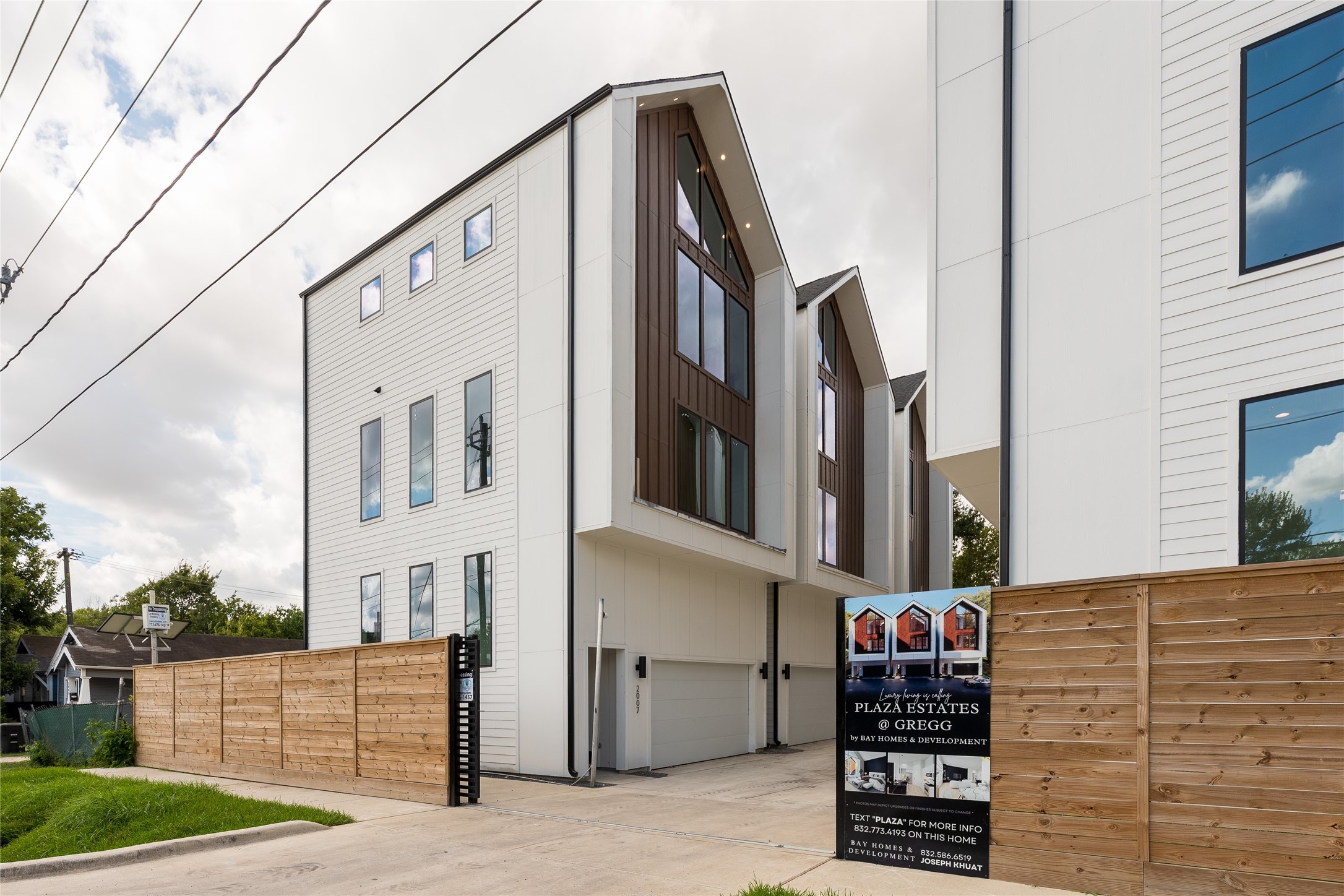 Modern home with sleek design, large windows, and a private garage, nestled in a gated community. Modern home with sleek design, large windows, and a private garage, nestled in a gated community.