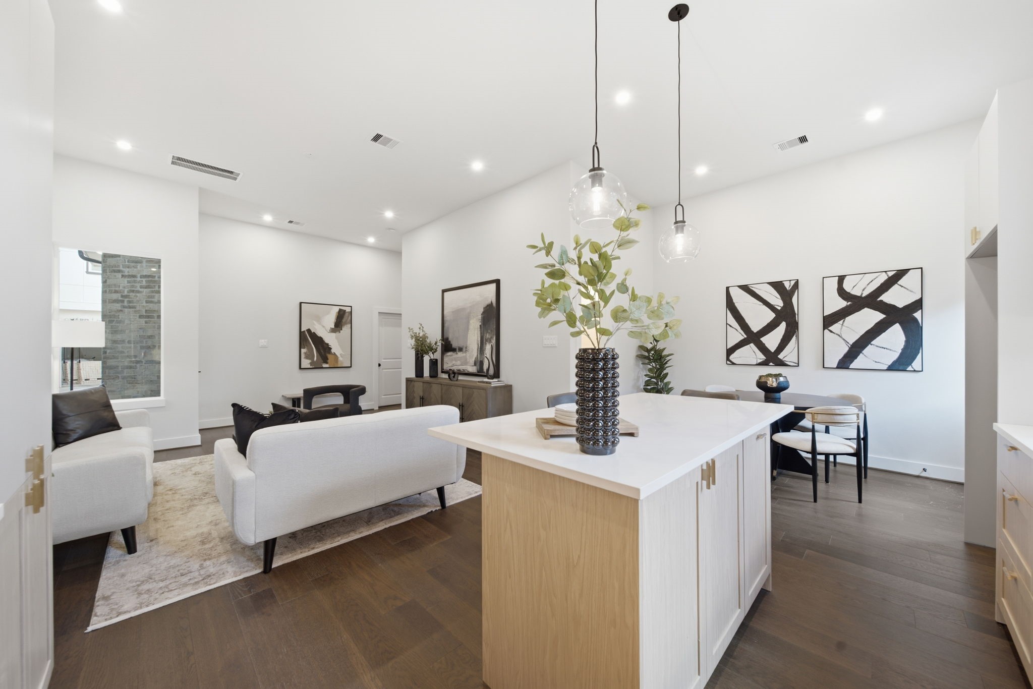 Kitchen with beautiful waterfall island, soft-close cabinetry & drawers.