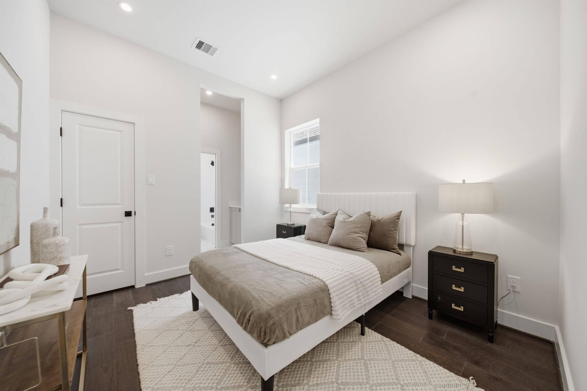 third bedroom with large closet and full bathroom with private vanity area attached