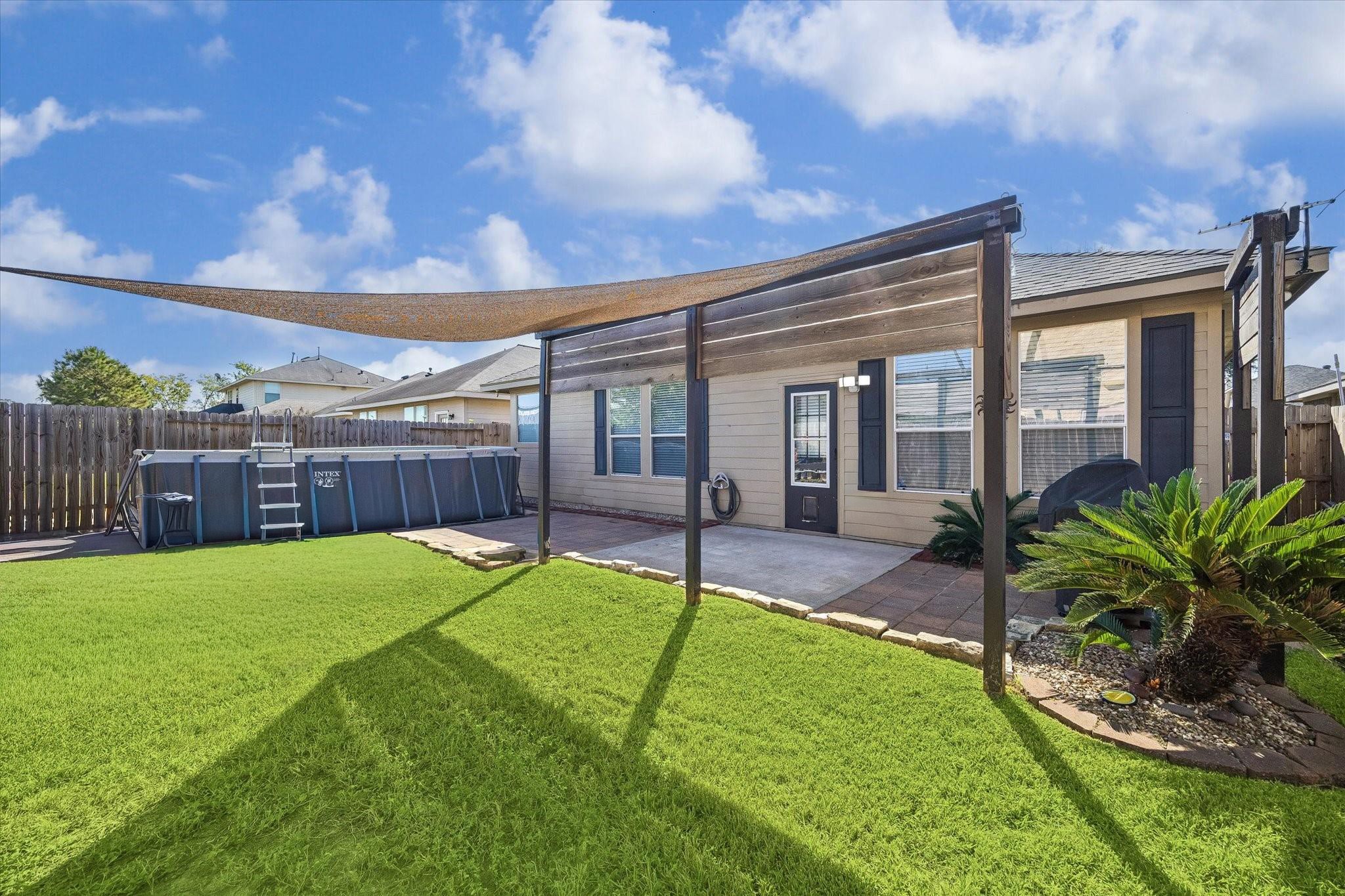 Enjoy the backyard with a spacious lawn, established landscaping, and a pergola that creates a welcoming spot for outdoor gatherings. There's plenty of room to relax, entertain, or enjoy a little fresh air.