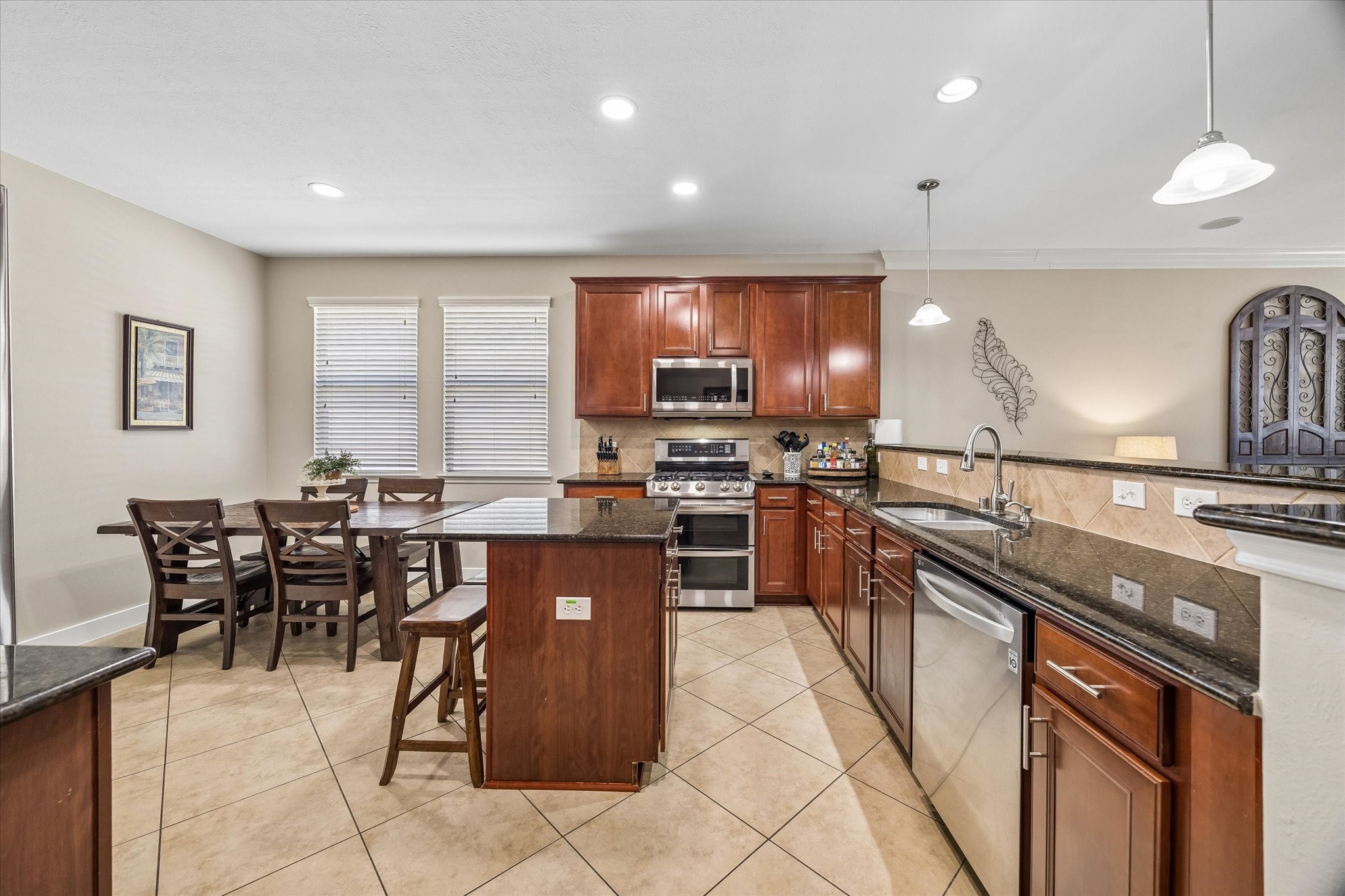 With a convenient breakfast area just steps away, the kitchen offers an easy setup for cooking, dining, and gathering. The center island provides additional prep space while keeping the room open and connected.