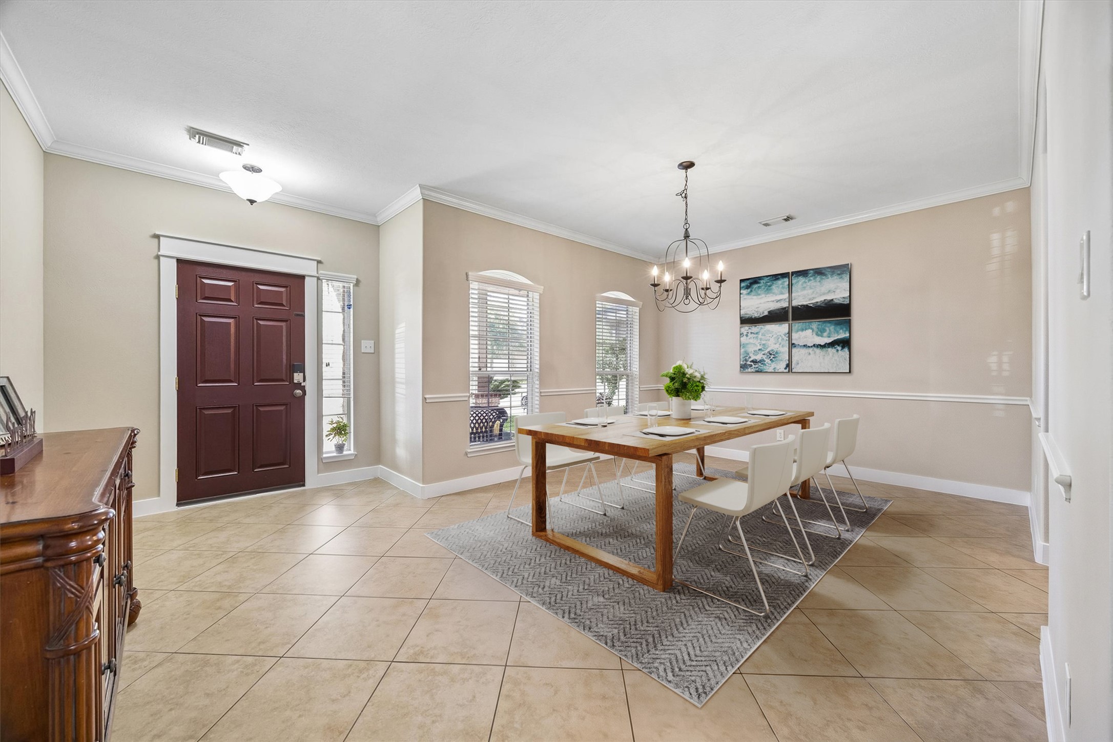 This inviting dining room offers plenty of space to gather for everyday meals or special occasions. Neutral finishes, tile flooring, and an open connection to the surrounding living spaces make entertaining easy.