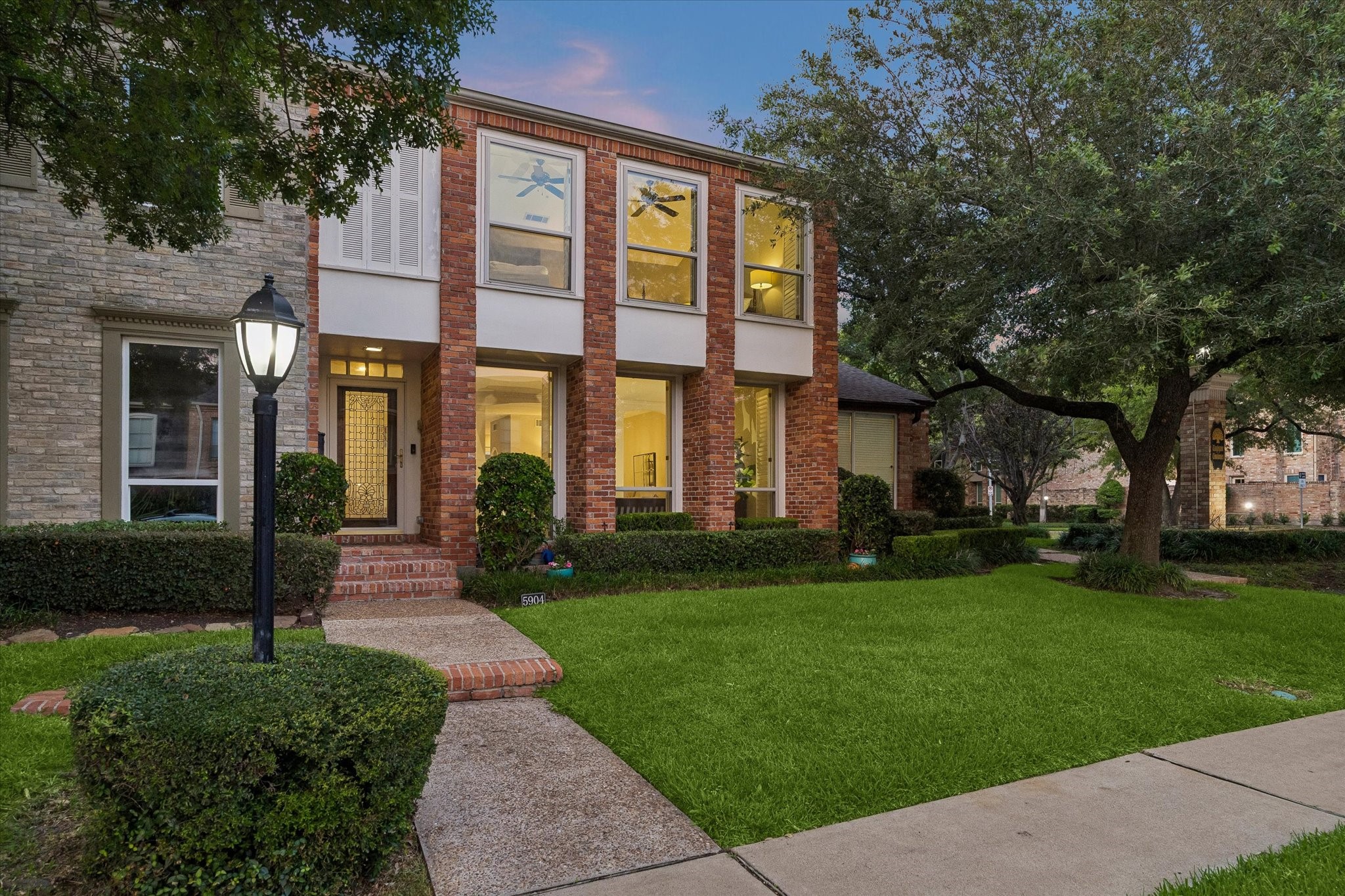Rare to find such convenience as this street facing front porch and walk. Note the endless street parking as well as guest parking within the community! NICE!