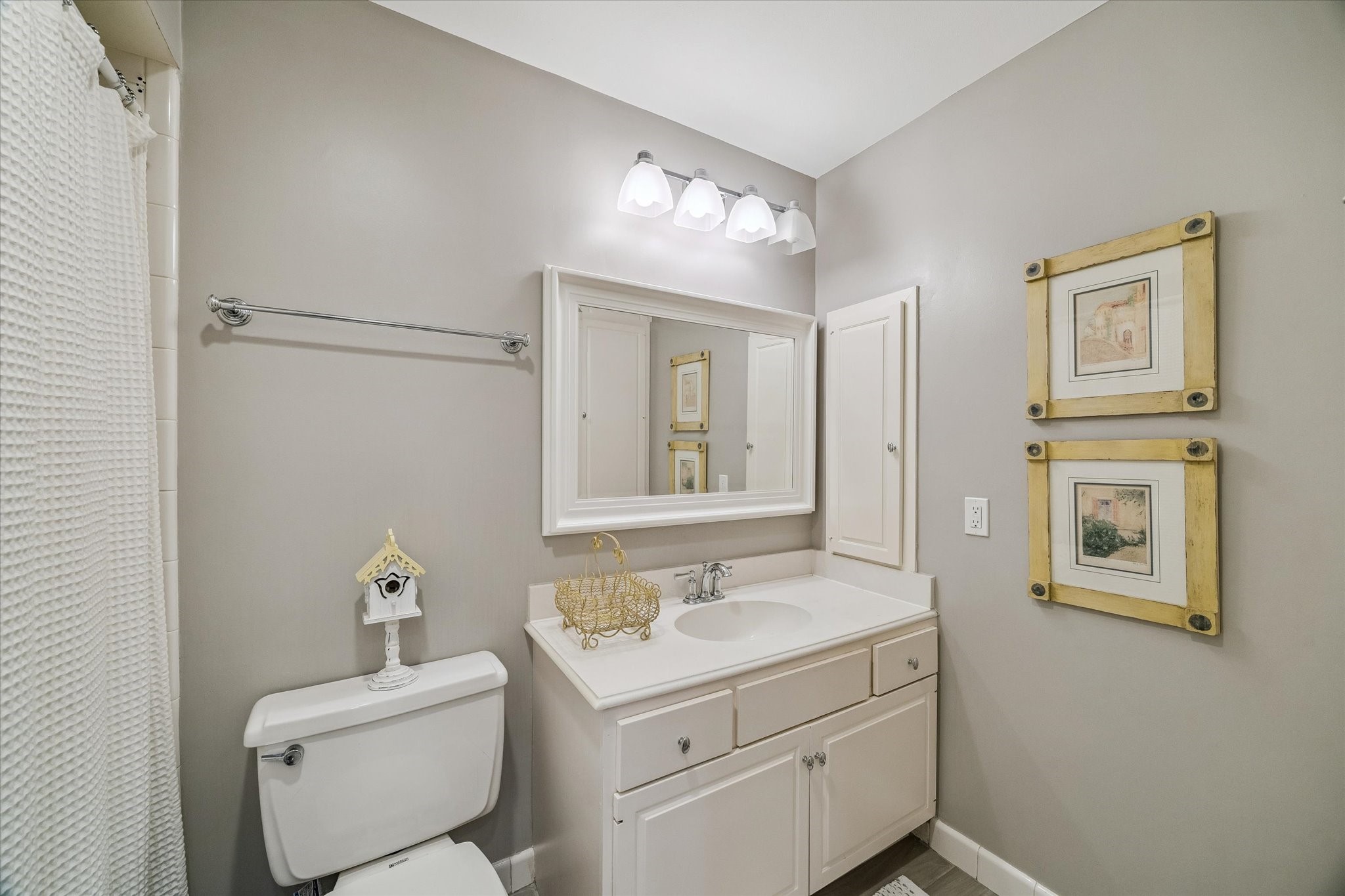 The in-suite Guest Bath is private to the Guest Bedroom and boasts a sparkling tub shower combo, built-in medicine cabinet and built-in floor to ceiling storage cabinets, decorative framed mirror and more!
