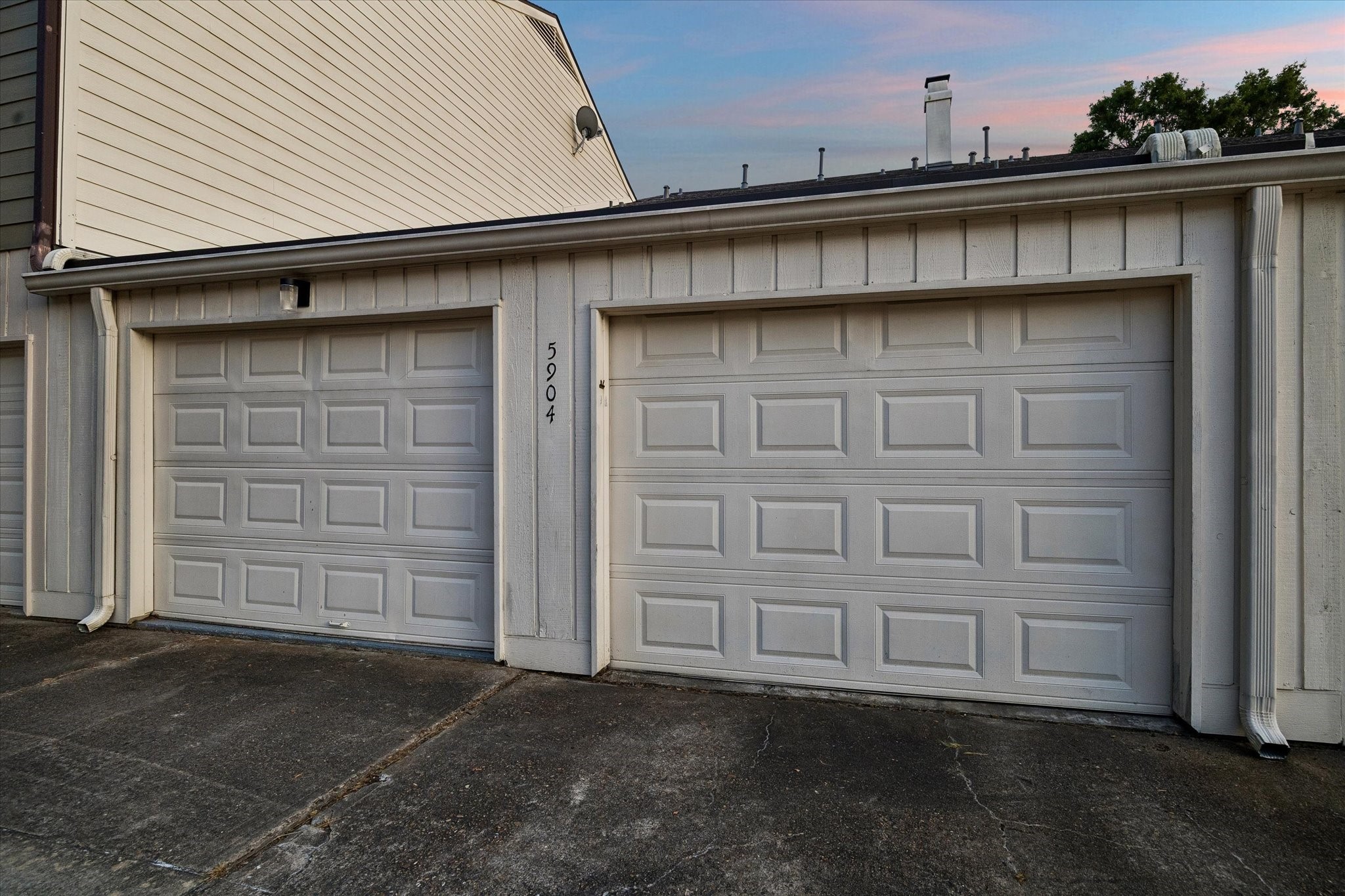 HOW GREAT IS THIS?! Seller remodeled the original carport to create 2 separate garages with their own automatic overhead doors and remotes! NOTE the massive back driveway promotes easy car/truck maneuverability and is only accessible thru one drive, adding security and eliminating drive thru traffic! WONDERFULLY CONVENIENT!