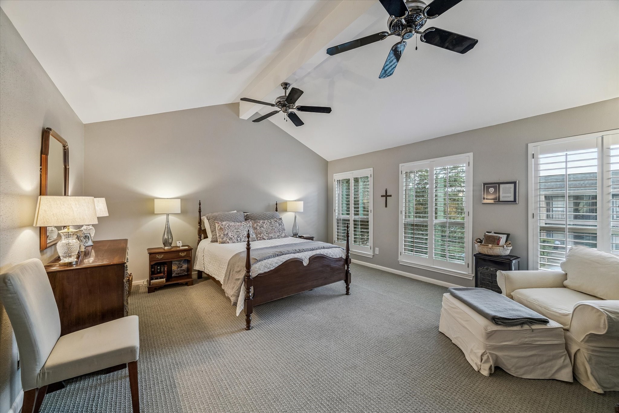 Ahhh, welcome to your lavish retreat in the trees! The massive Primary Suite boasts vaulted ceilings dual ceiling fans, full length double pane windows & custom plantation shutters with tree top views, designer loop carpeting and a lavish bath ideal for sharing or simply living the life of luxury! NOTE: all the space - plenty for a separate sitting area, exercise space, desk or work area, what EVER you desire! ENJOY & SLEEP TIGHT!