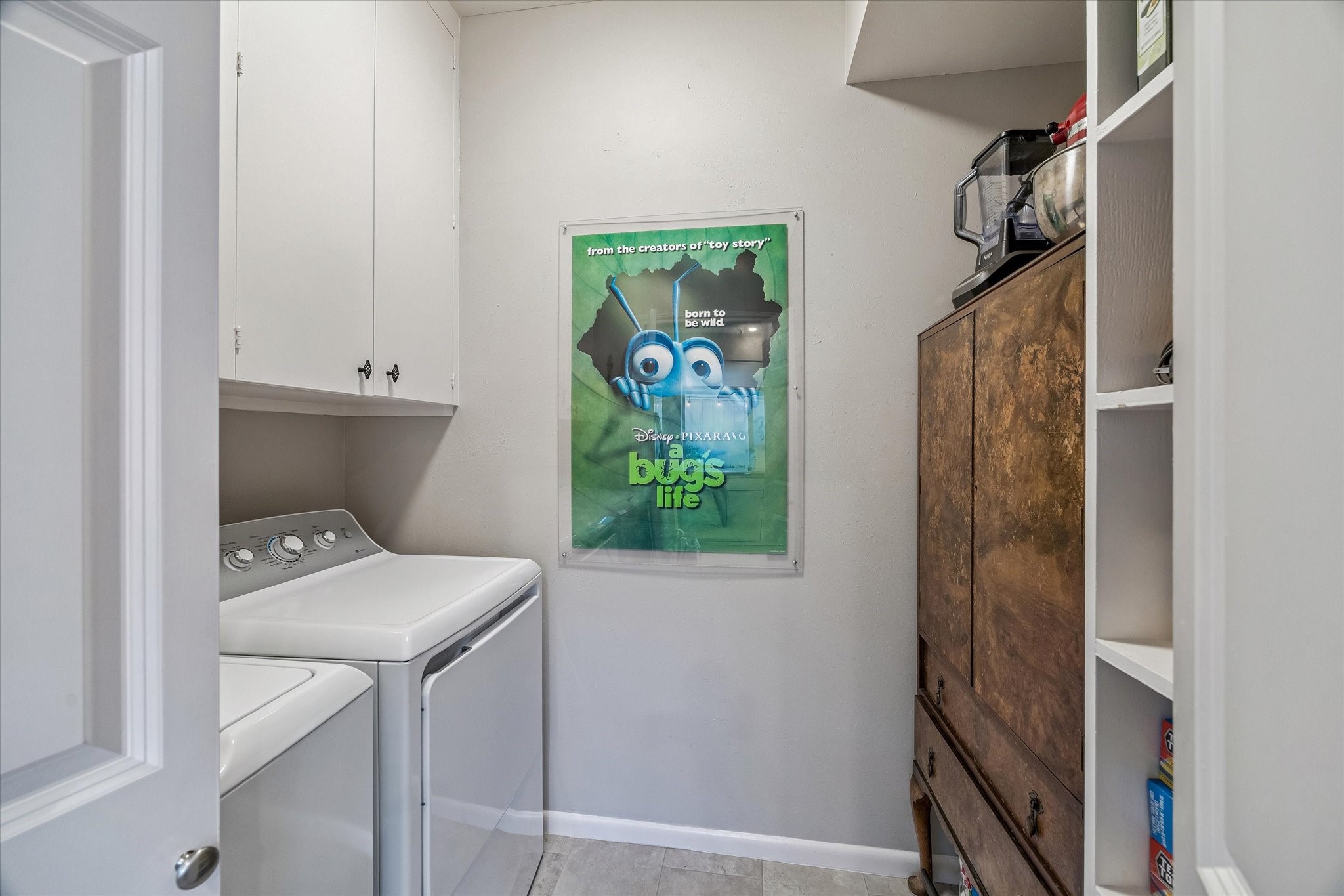 The spacious walk-in Pantry/Laundry Room boasts endless storage for those large Grocery or Costco runs and is convenient beyond measure! NICE!