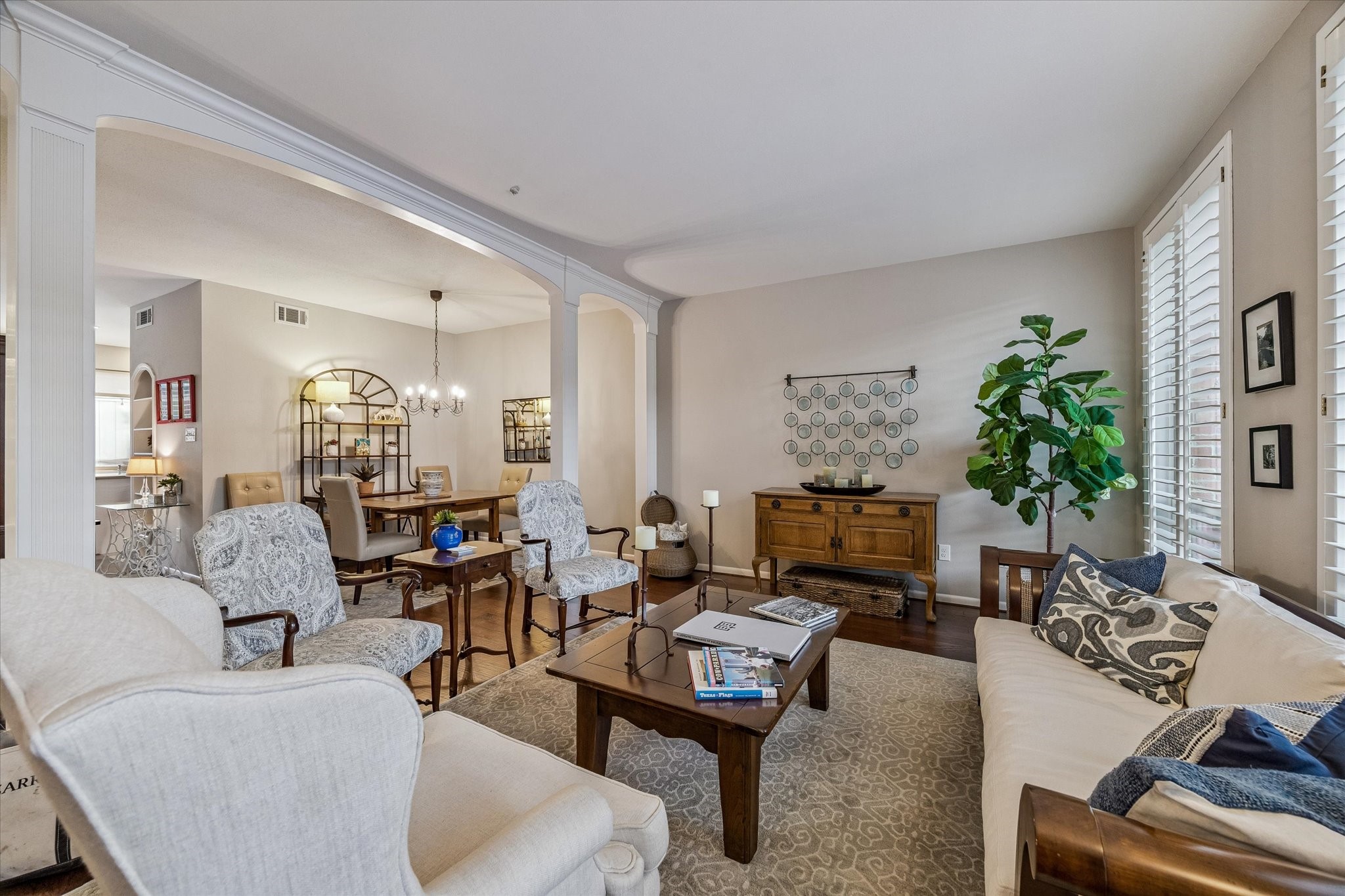 You must see to appreciate the grand size and endless natural light created by the large floor to ceiling windows, and expanded open arched opening between the Dining Room and Living Room. Note there's an elegant Bar just out of this picture!