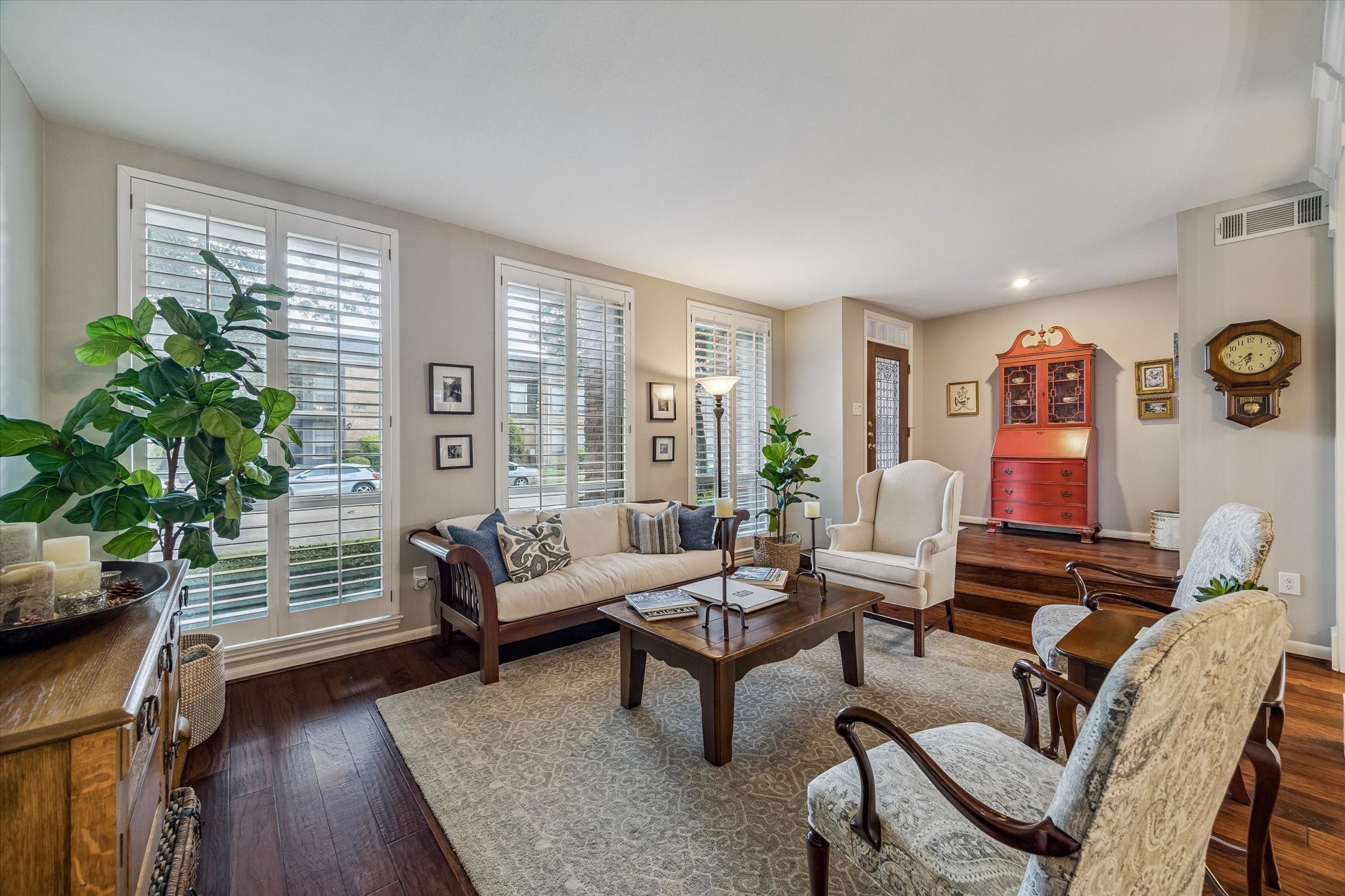 Once inside you'll marvel at the grand open spaces ideal for entertaining! Note the wide plank wood flooring, soft neutral colors, custom plantation shutters and abundant natural light!
