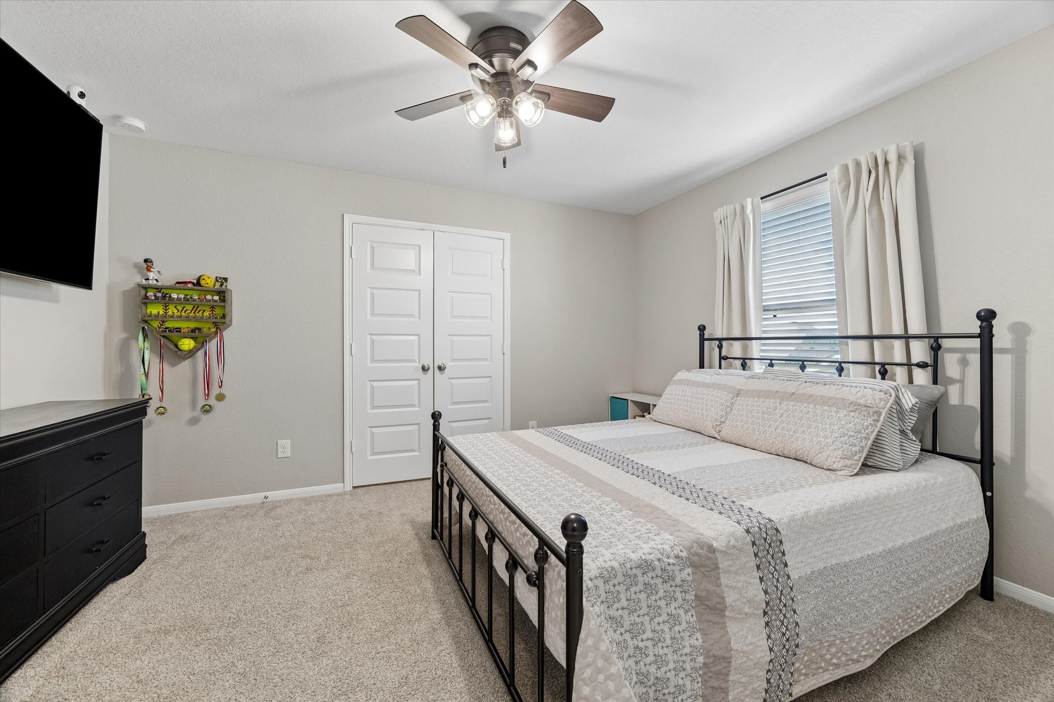 This spacious upstairs secondary bedroom offers plenty of room to make it your own, complete with a huge walk-in closet for generous storage.