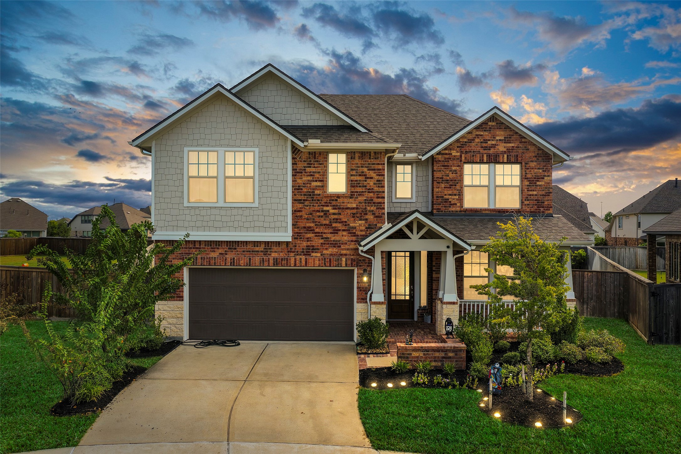 Beautiful two-story home with inviting curb appeal and mature landscaping.
