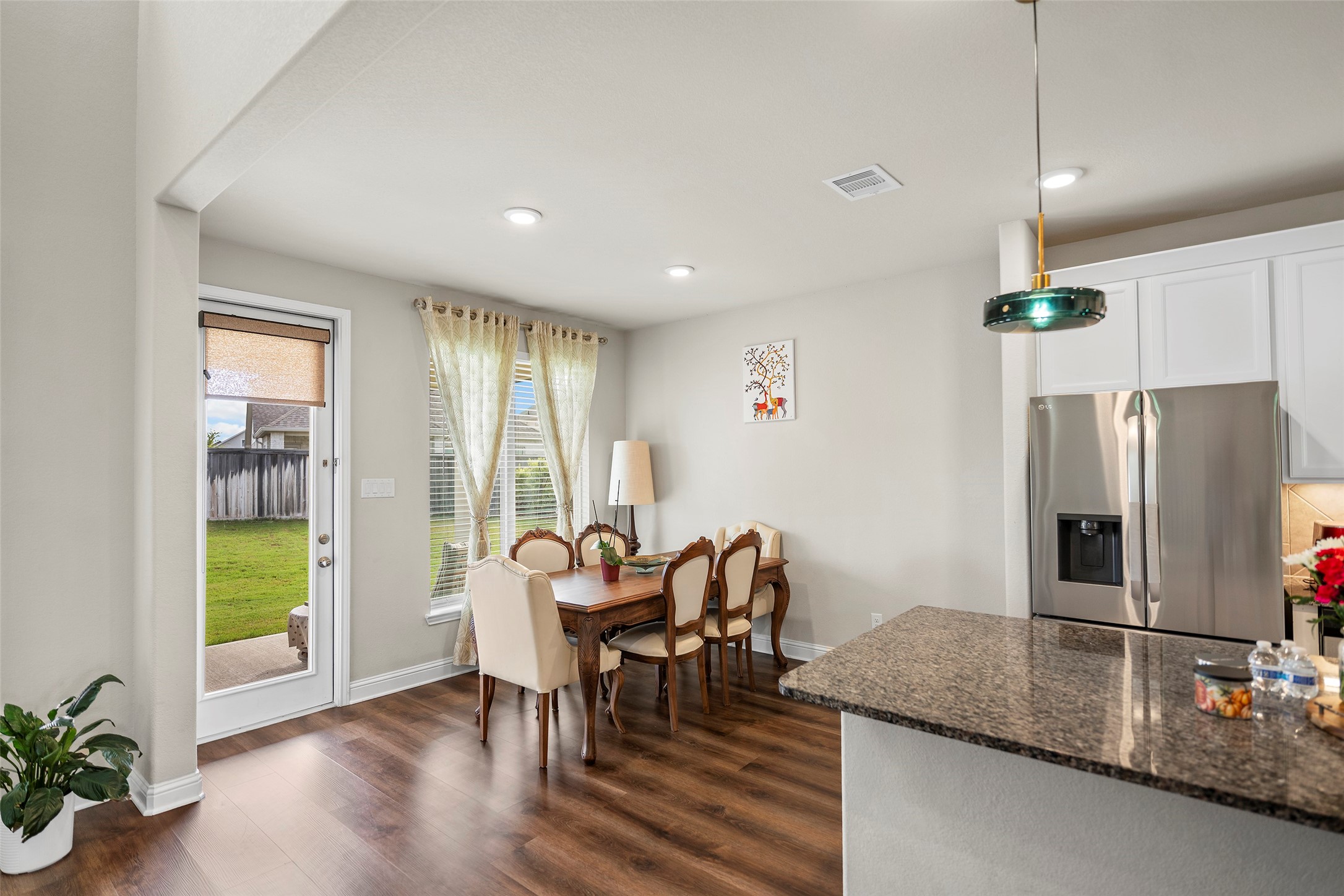 Open dining area connecting the kitchen and living spaces.