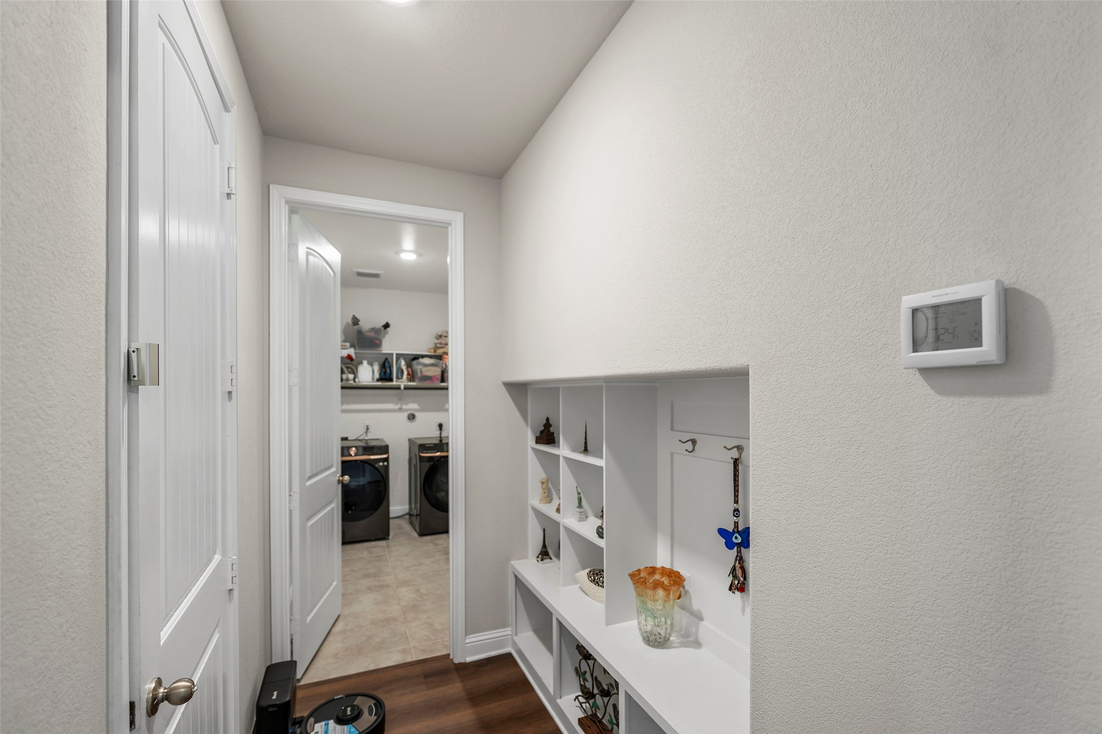 Interior hallway with access to the utility room.