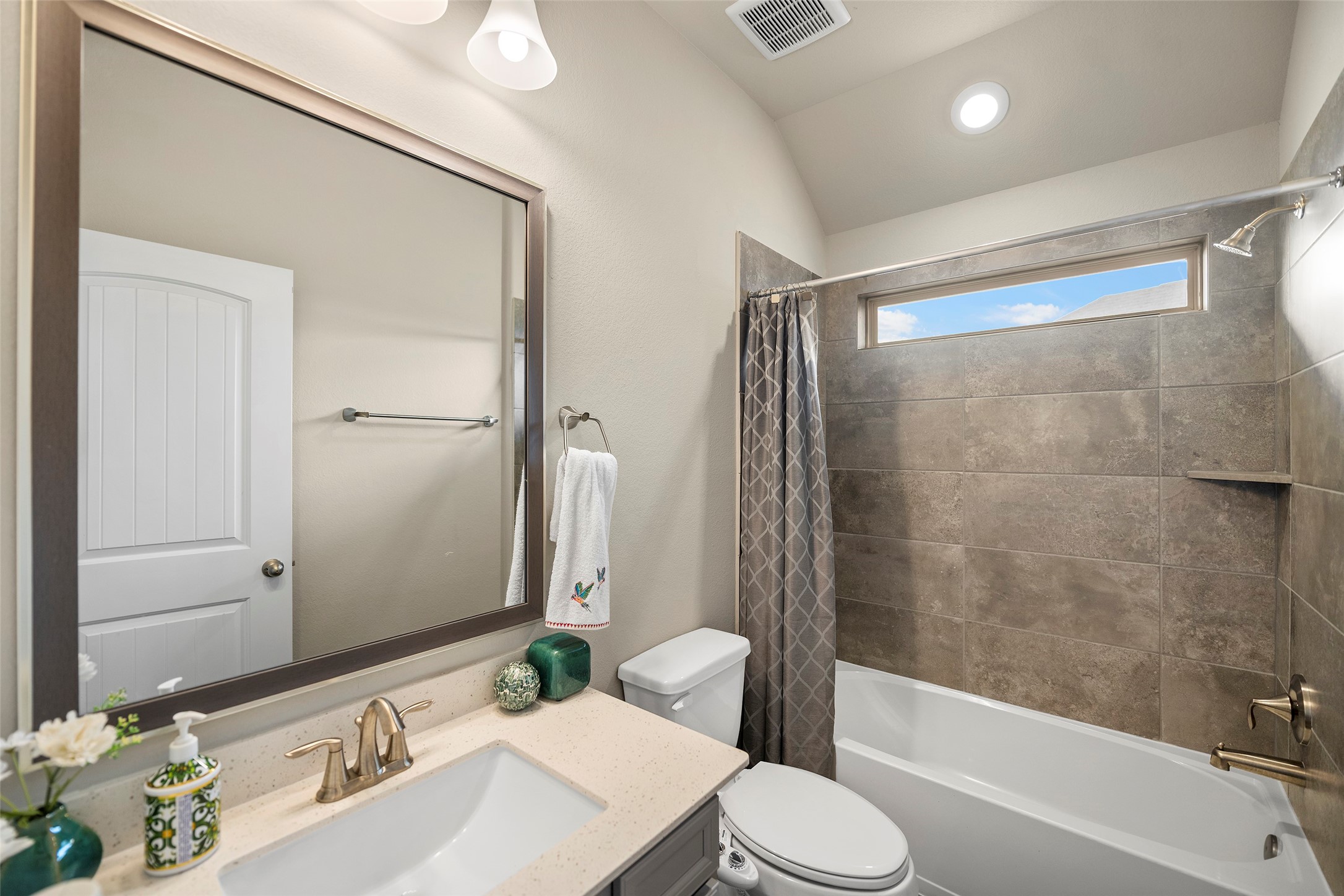 Full bathroom with a tub and shower combination.