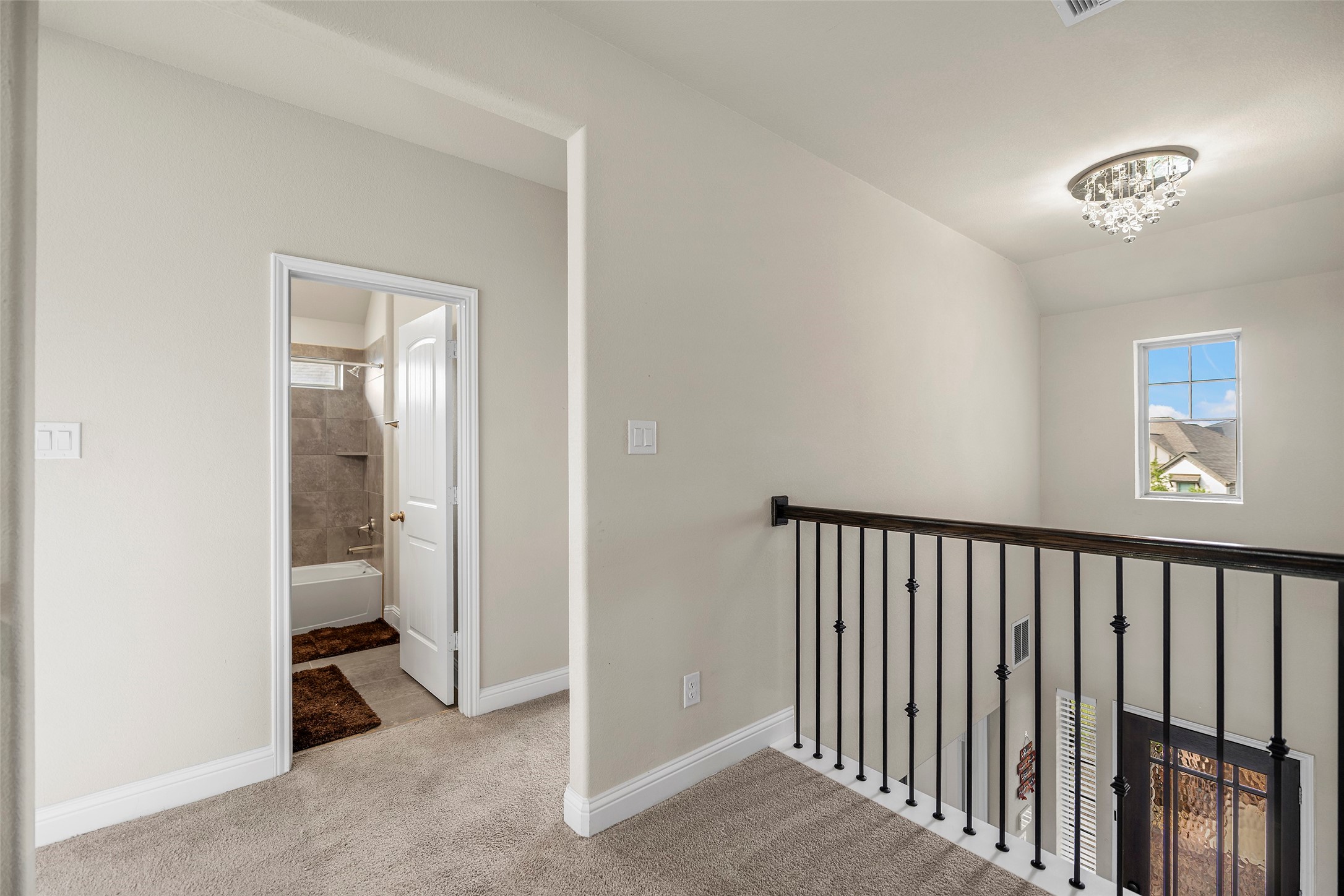 Upstairs landing overlooking the main living area below.