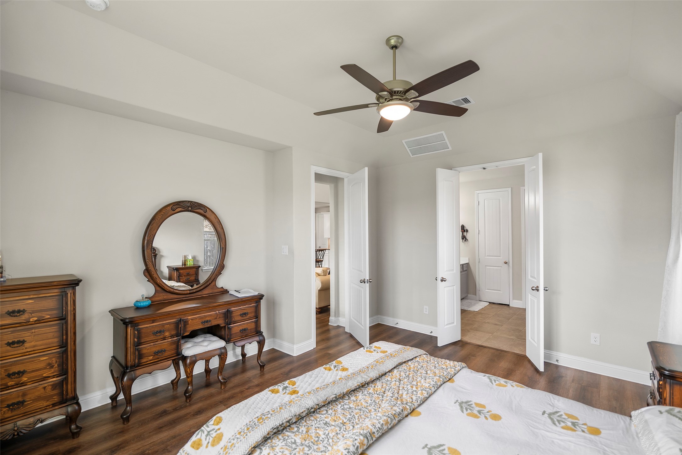 Another view of the primary bedroom showcasing its generous layout.