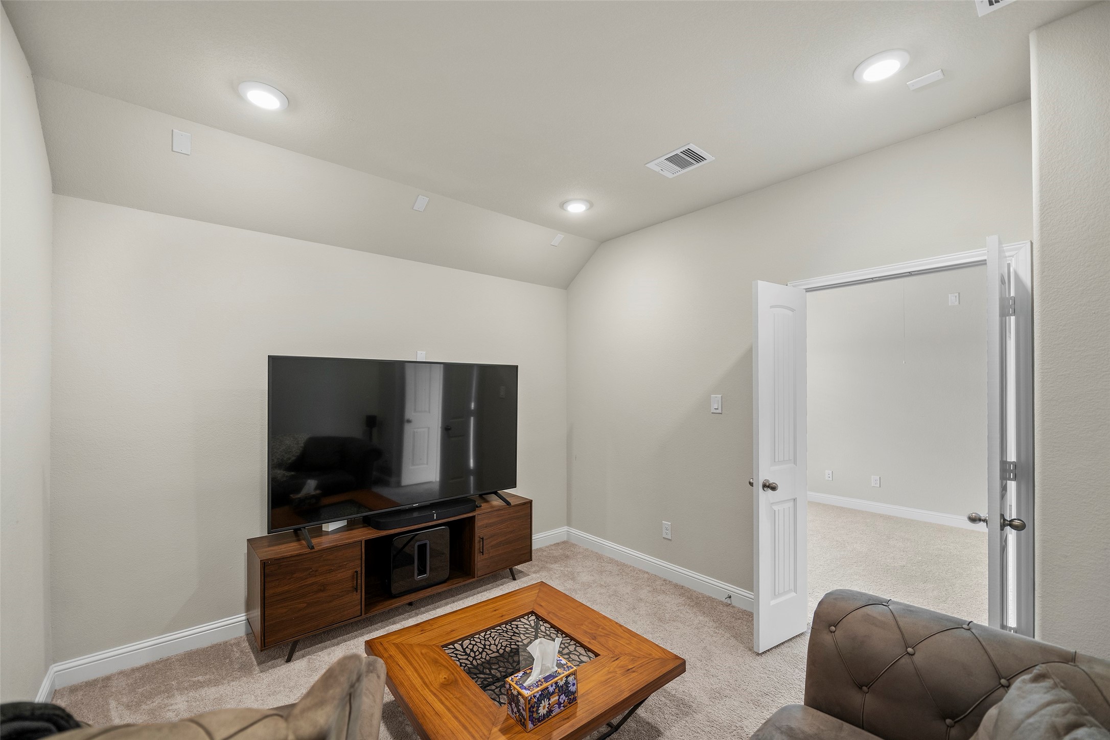 Another view of the media room showcasing the flexible layout.