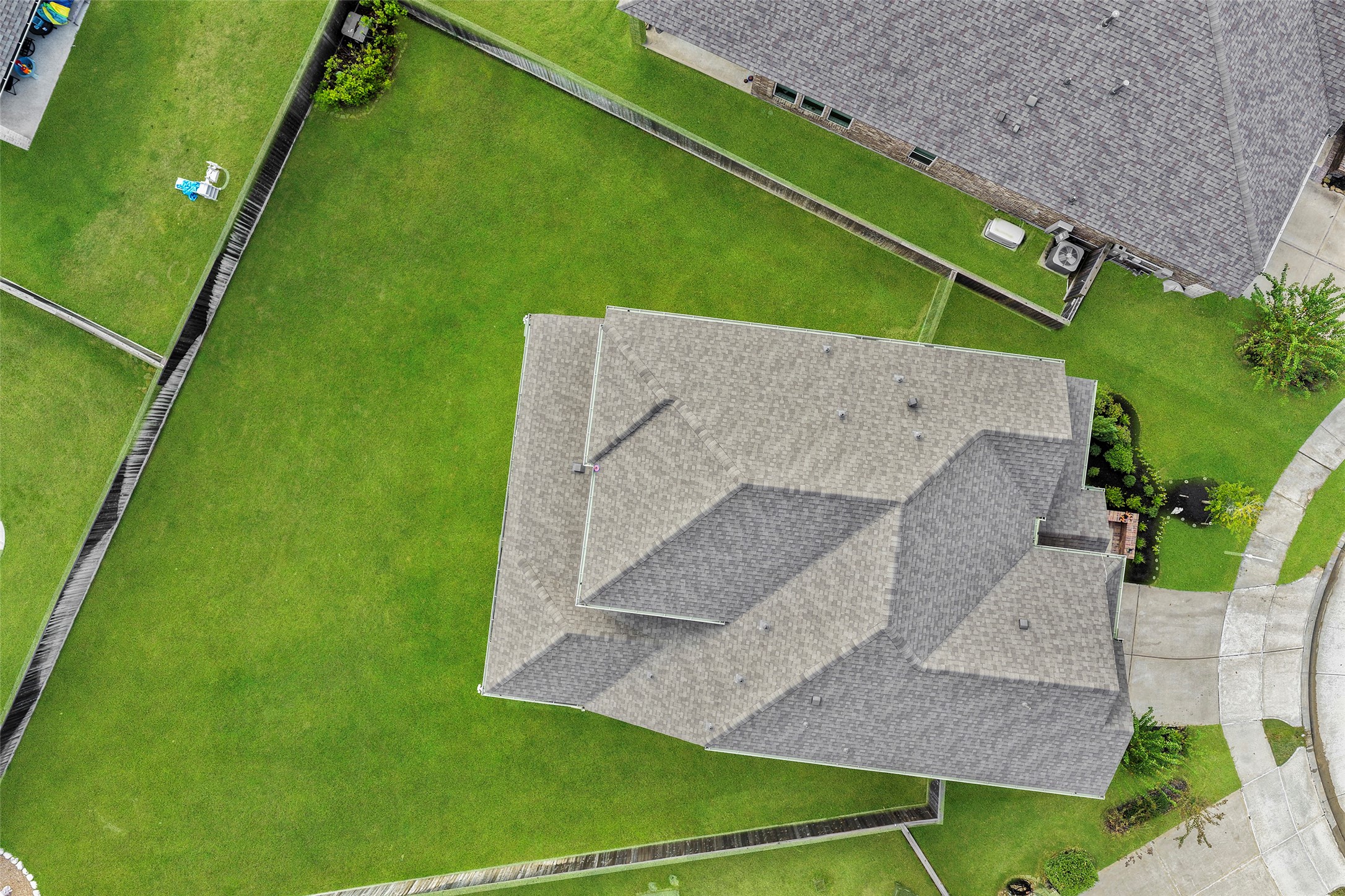 Aerial view highlighting the home and spacious cul-de-sac lot.