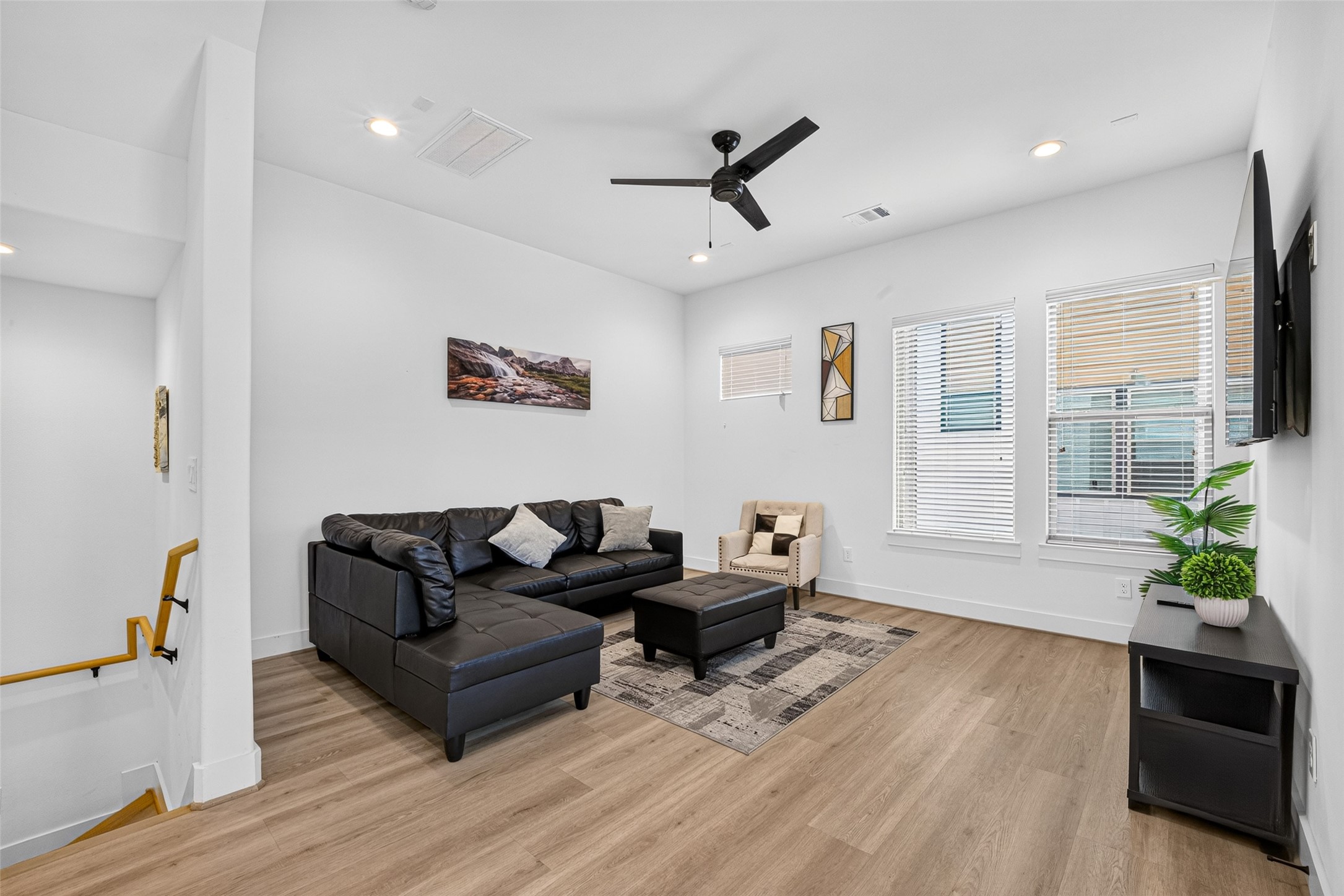 Large windows fill the living area with constant natural light, highlighting the generous dimensions that leave plenty of flexibility for furnishings and entertaining.