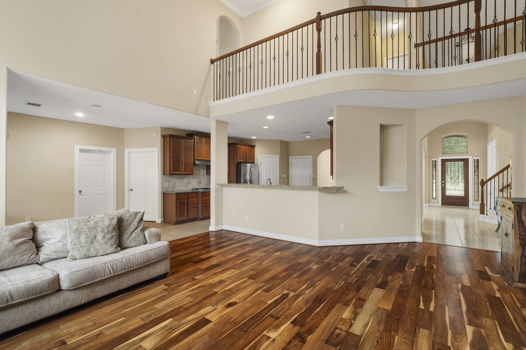 An open upstairs hallway creates a seamless connection between the home's upper and lower living spaces.