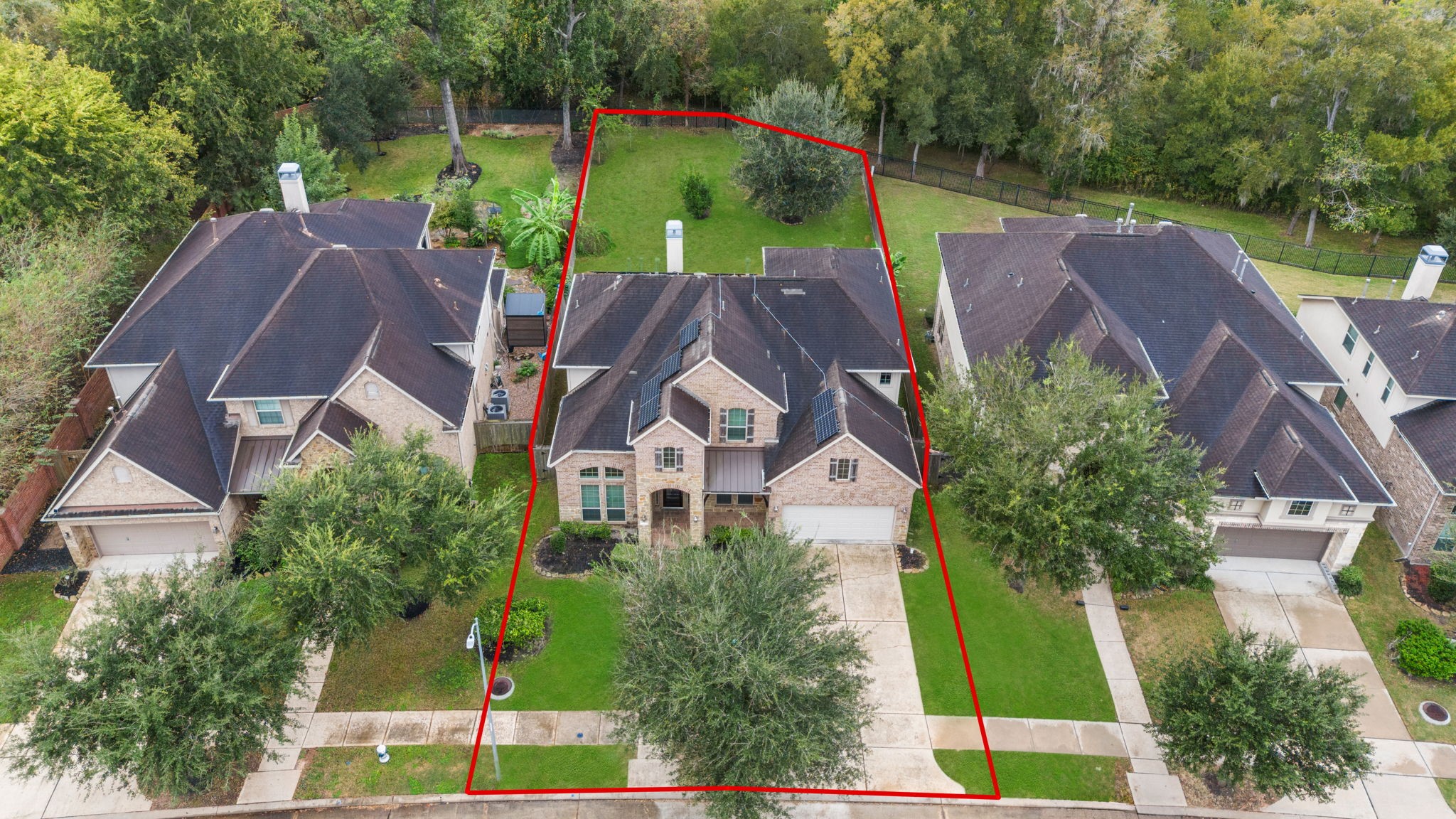 An oversized attached two-car garage and double-wide driveway provide plenty of off-street parking for family and guests.