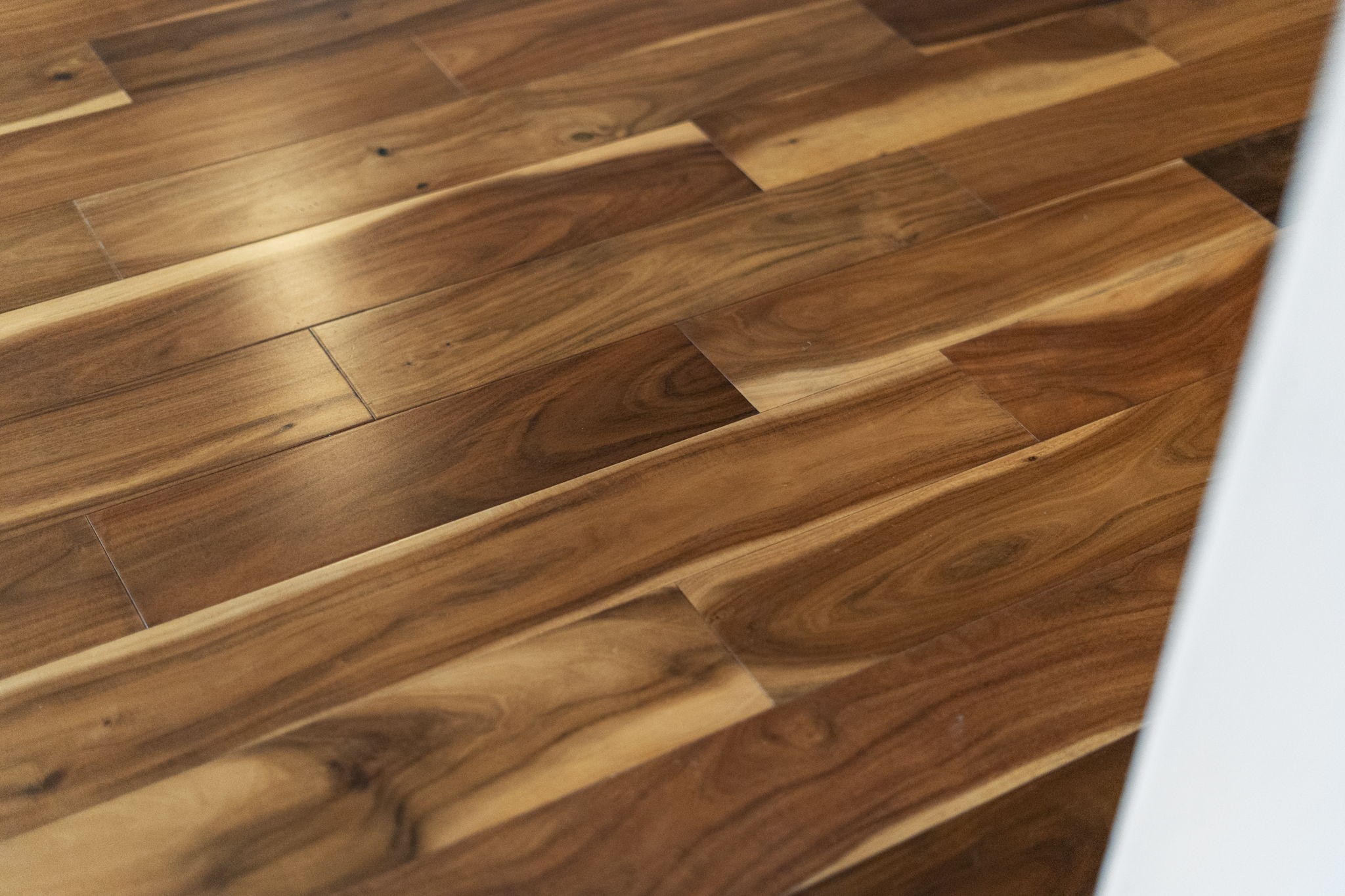 Rich wood flooring adds warmth and character.