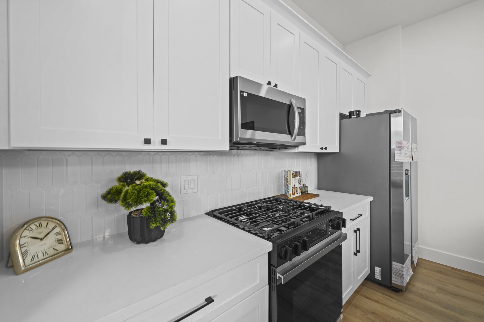 Enjoy cooking in this modernly designed kitchen with quartz countertops.