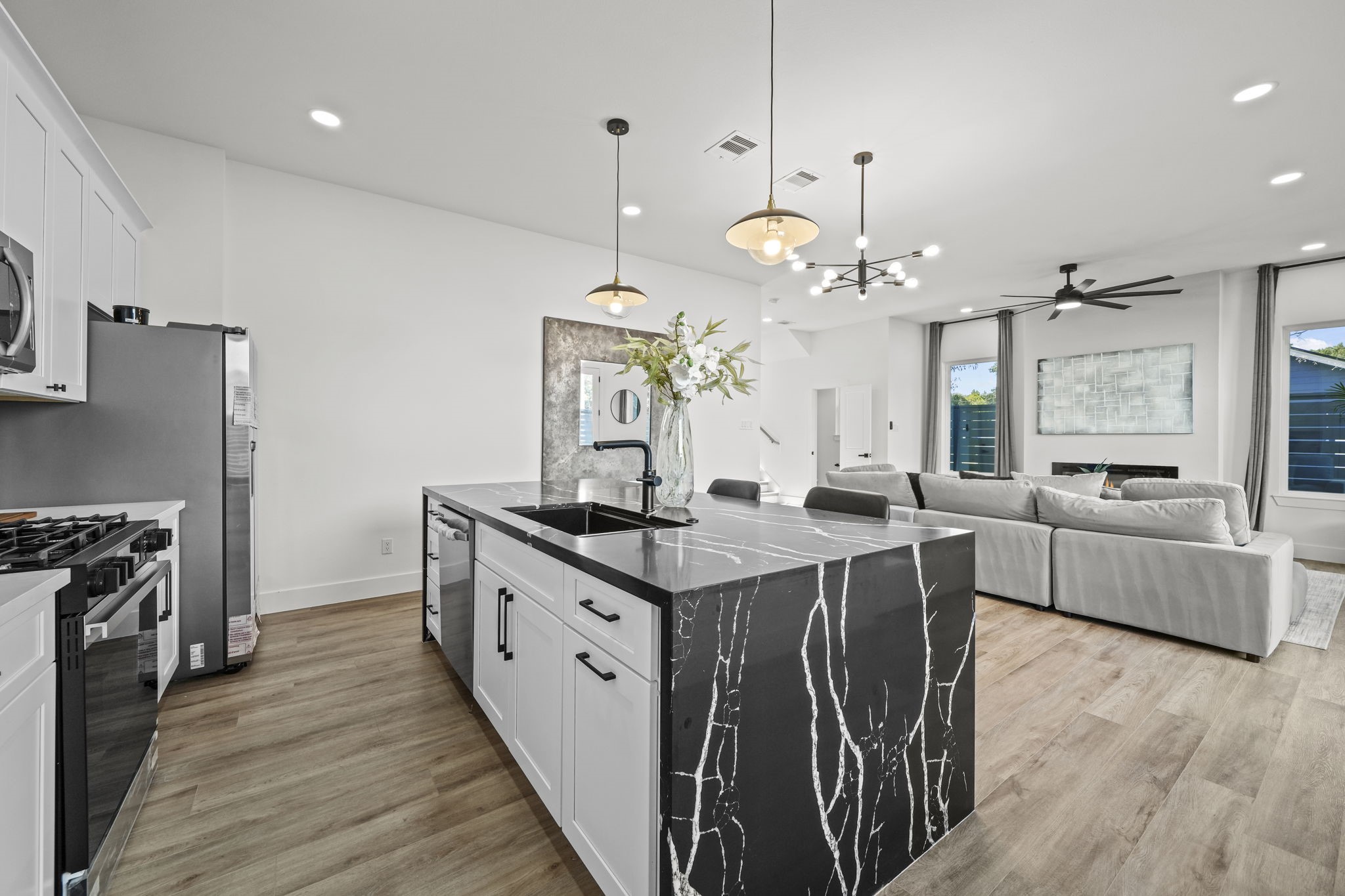 The island offers more cabinet space and a stainless steel dishwasher.
