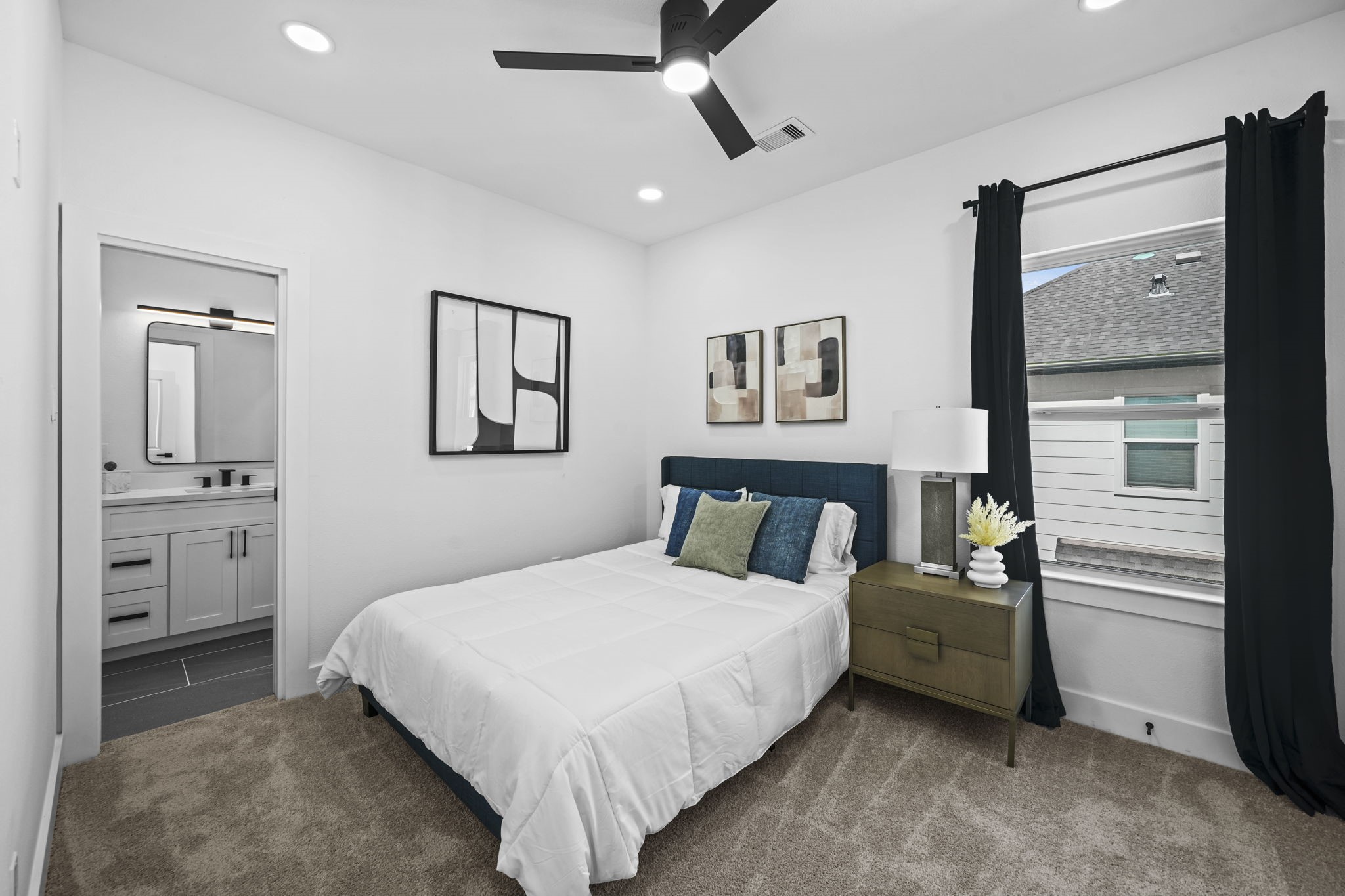 The third bedroom on the second floor with a bathroom entrance.