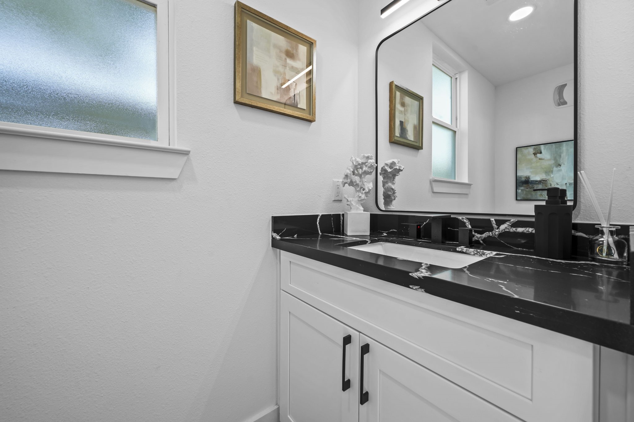The powder room located by the front entrance.