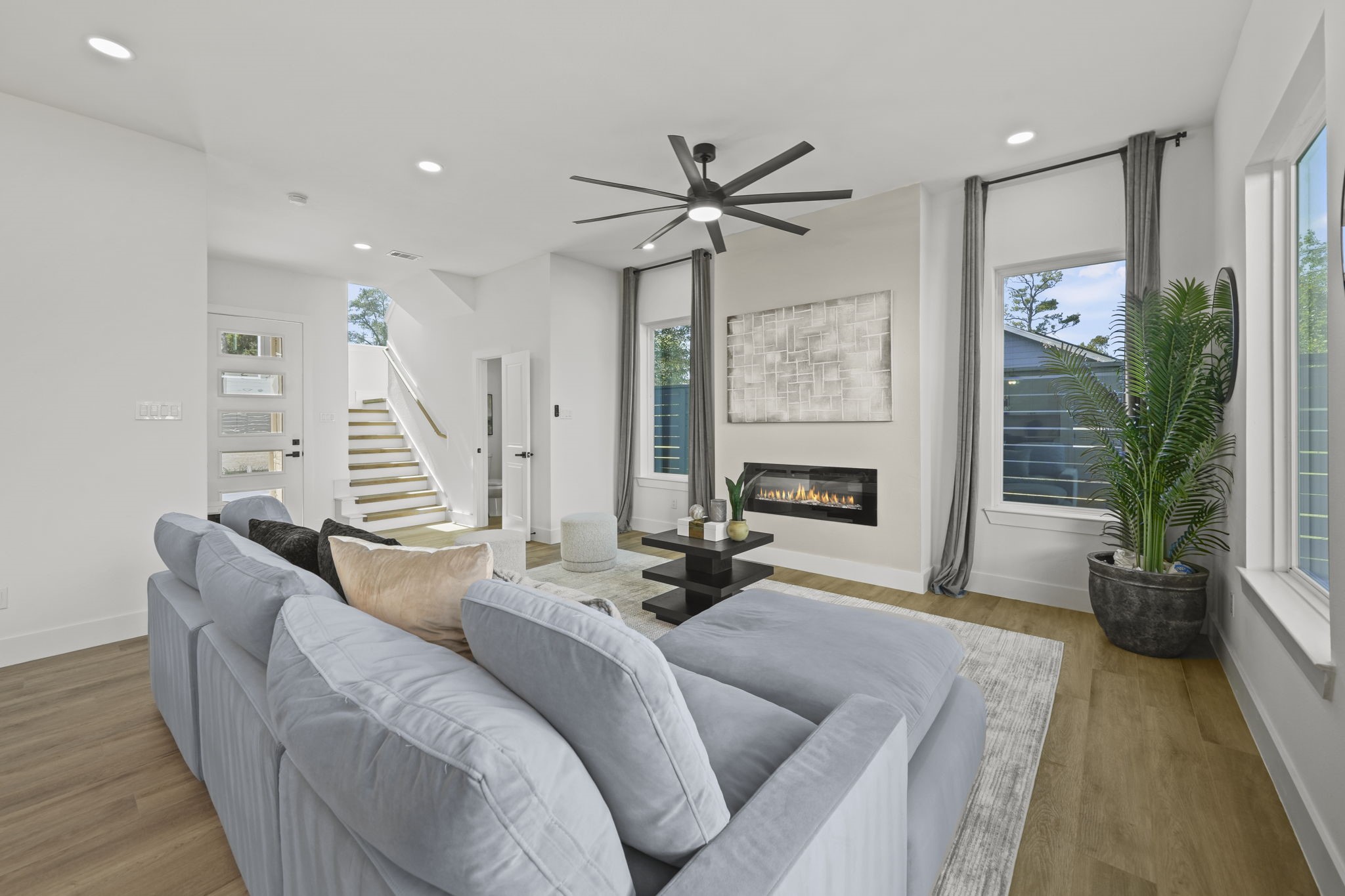 Another angle of the living room showing the spaciouness and stairway to the second floor.