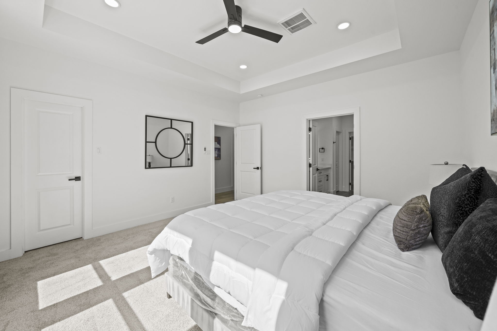 The primary bedroom offering a retreat like en-suite and two closets.