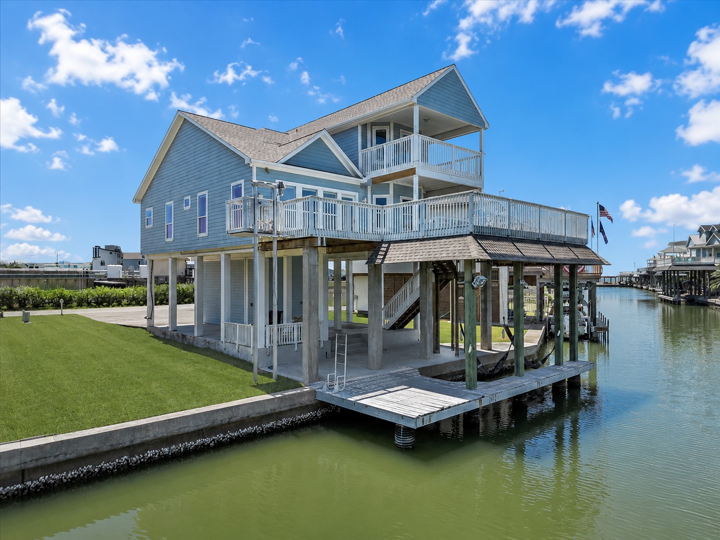 Experience elevated waterfront living in Tiki Island! This immaculately maintained coastal retreat welcomes you