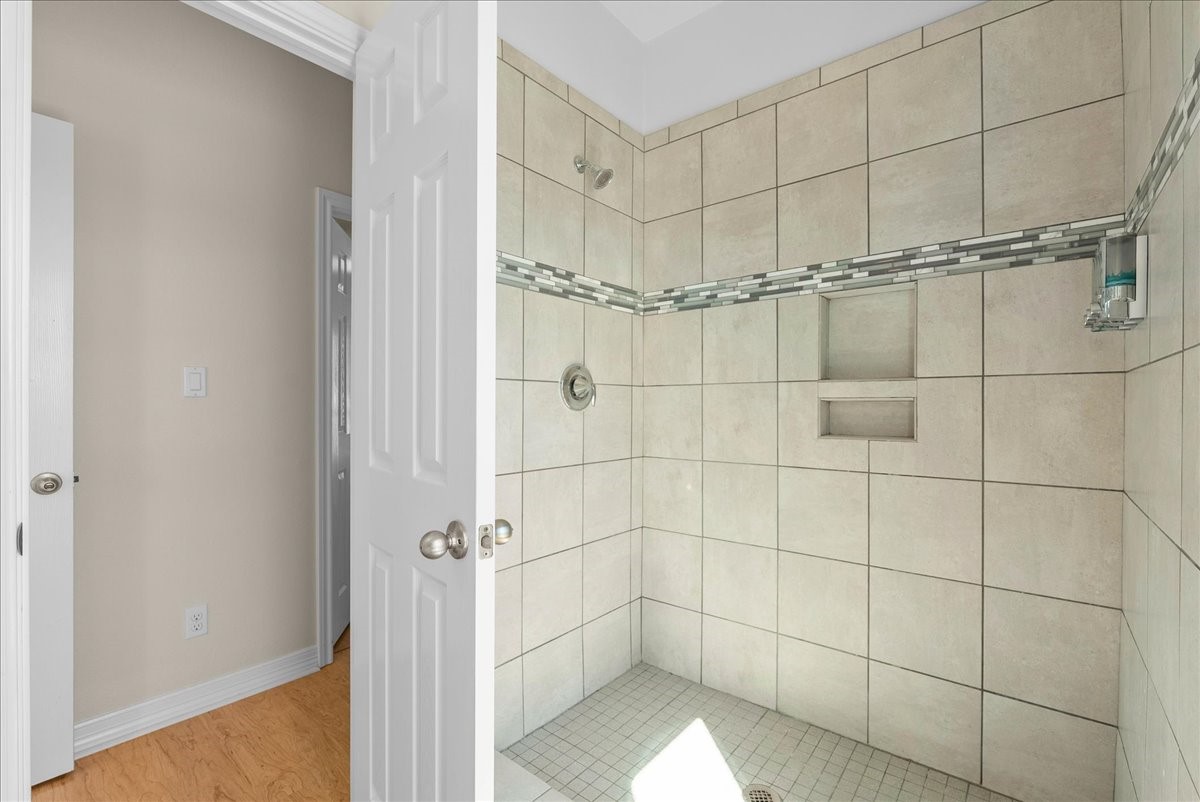 Full bath #1, conveniently located on the first floor, features a spacious walk-in shower.