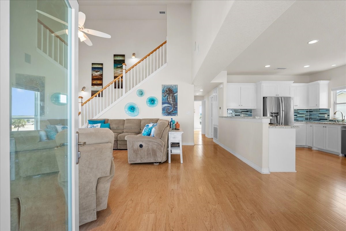 Enter to soaring ceilings and open-concept living with an abundance of windows showcasing beautiful waterfront views. Enter to soaring ceilings and open-concept living with an abundance of windows showcasing beautiful waterfront views.