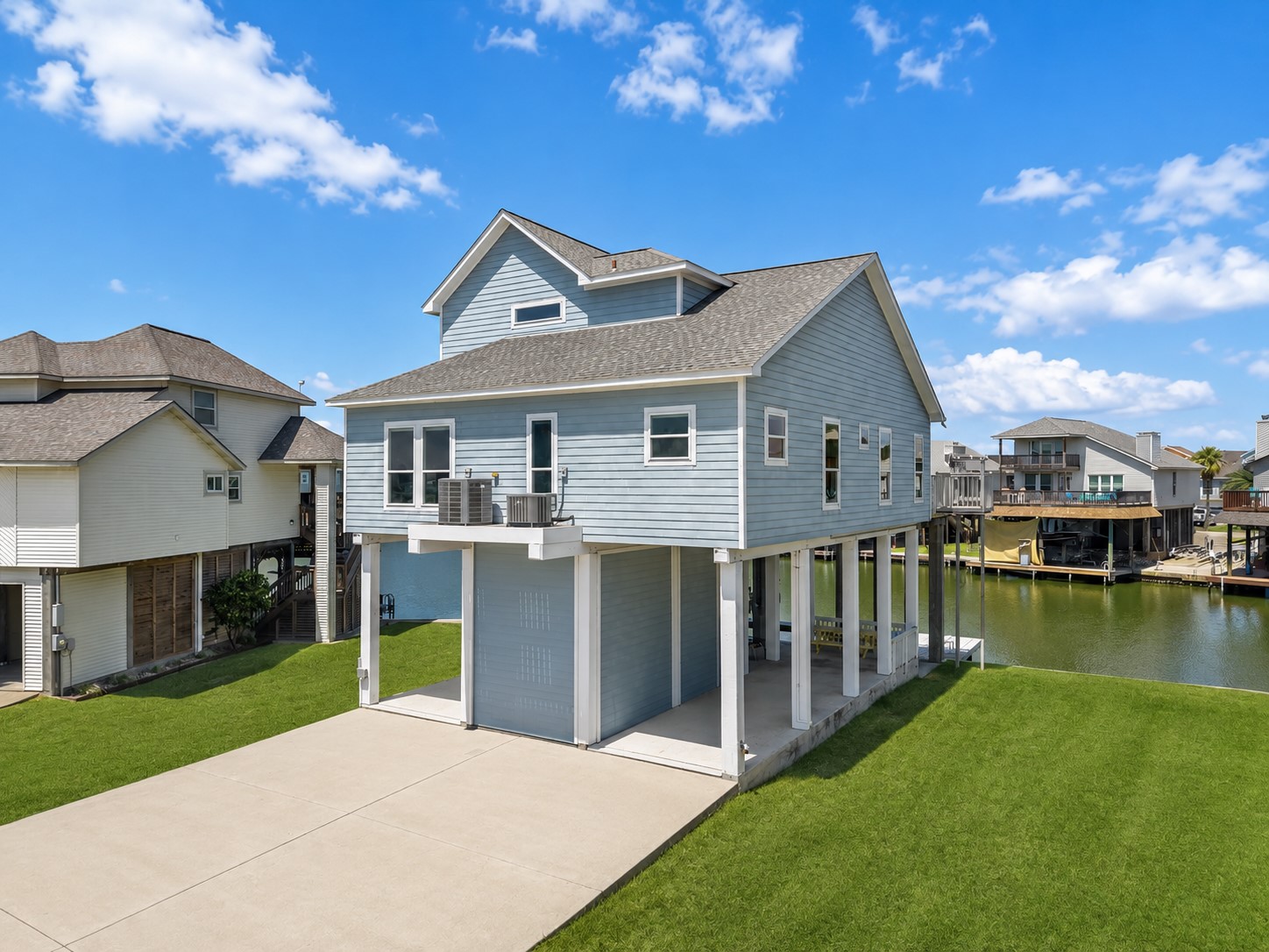 Experience elevated waterfront living in Tiki Island! This immaculately maintained coastal retreat welcomes you