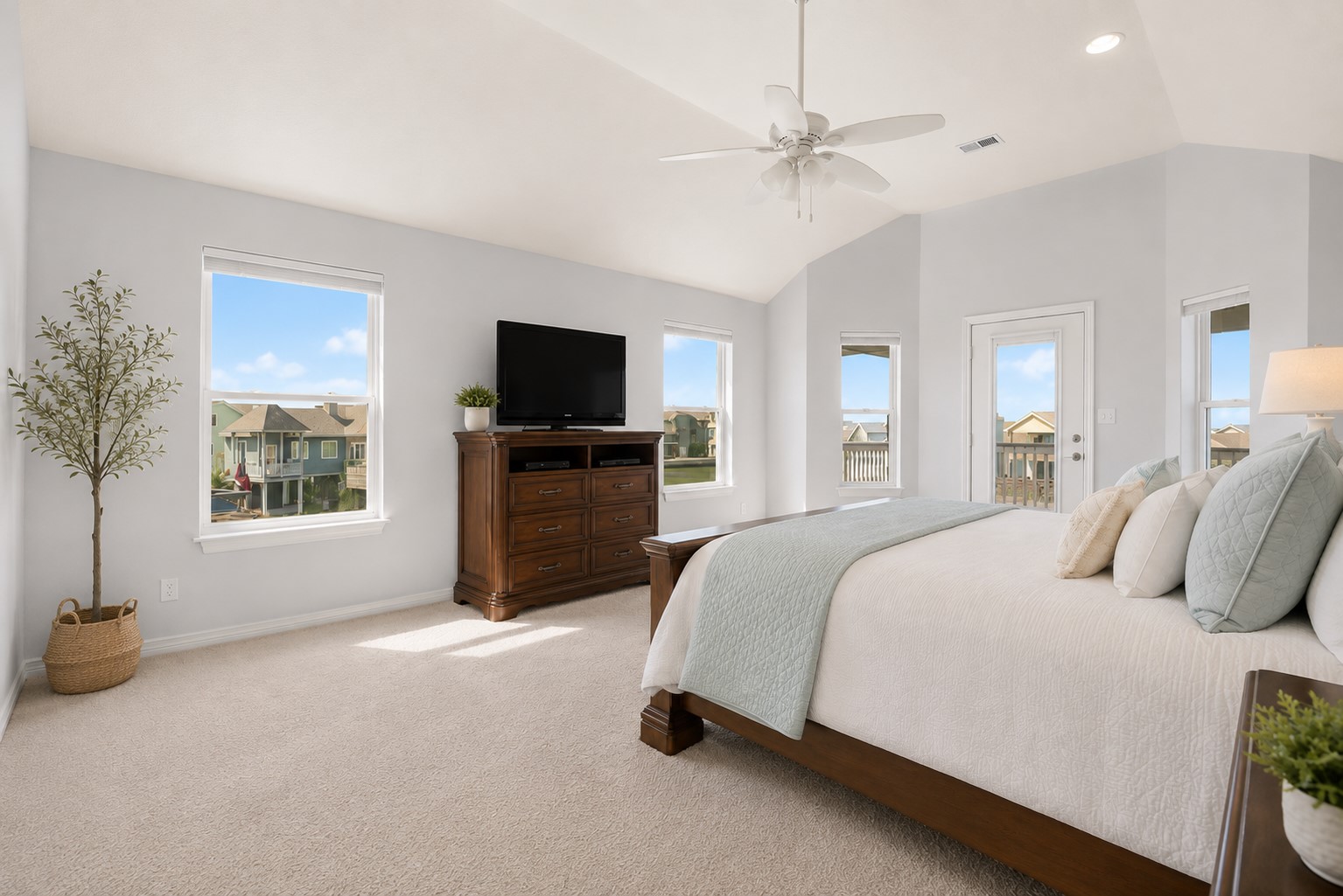On the second floor, the private primary retreat offers its own waterfront balcony and spa-inspired en-suite with soaking tub, walk-in shower, dual sinks, and walk-in closet.