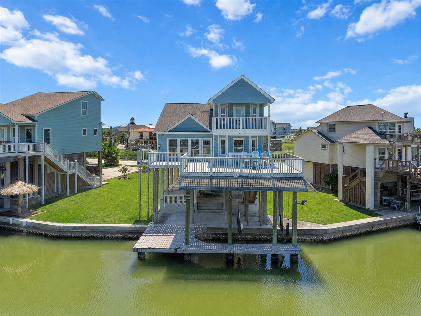 Experience elevated waterfront living in Tiki Island! This immaculately maintained coastal retreat welcomes you