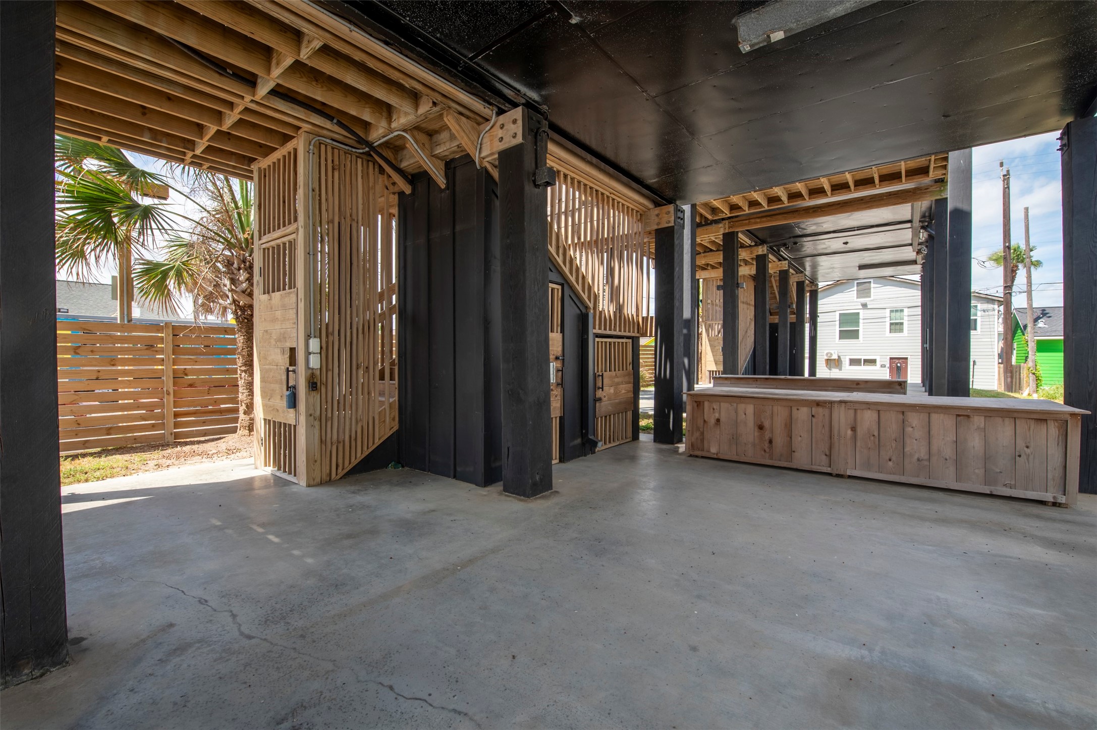 Front house private gated stairwell and private outdoor shower.
