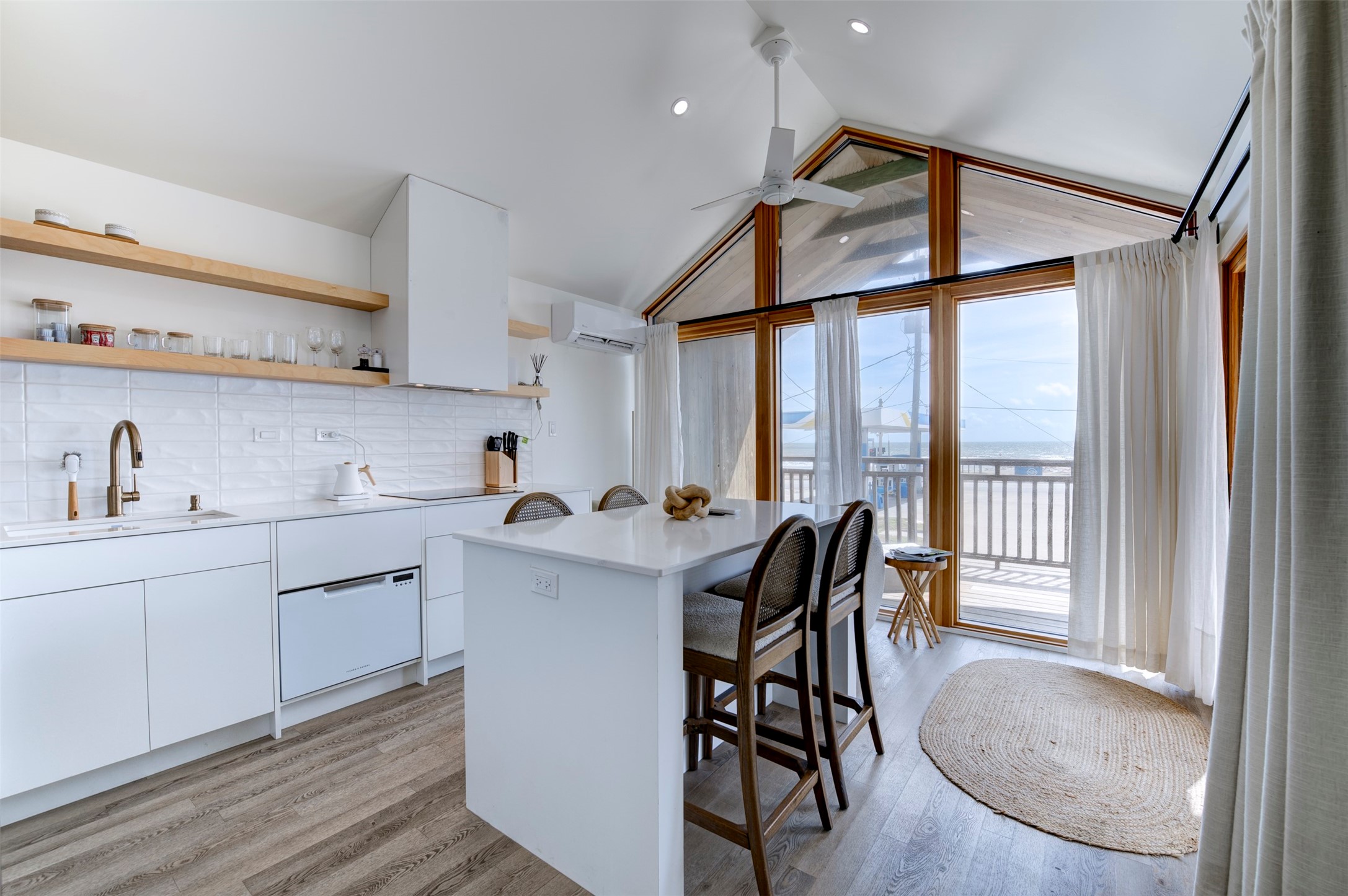 Front house kitchen with quartz island and gulf views