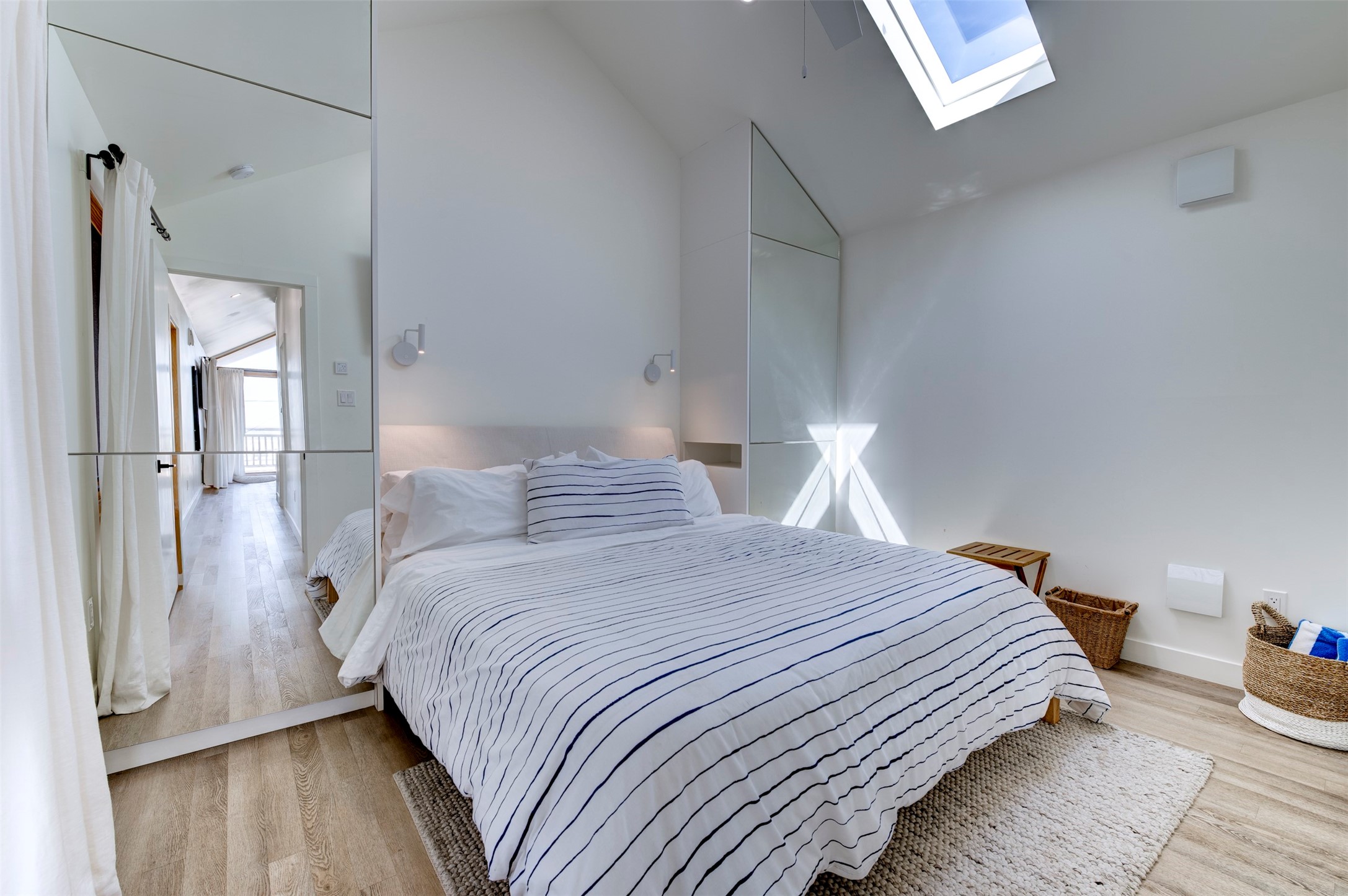 Front house primary king bedroom with built-in wardrobes and skylight